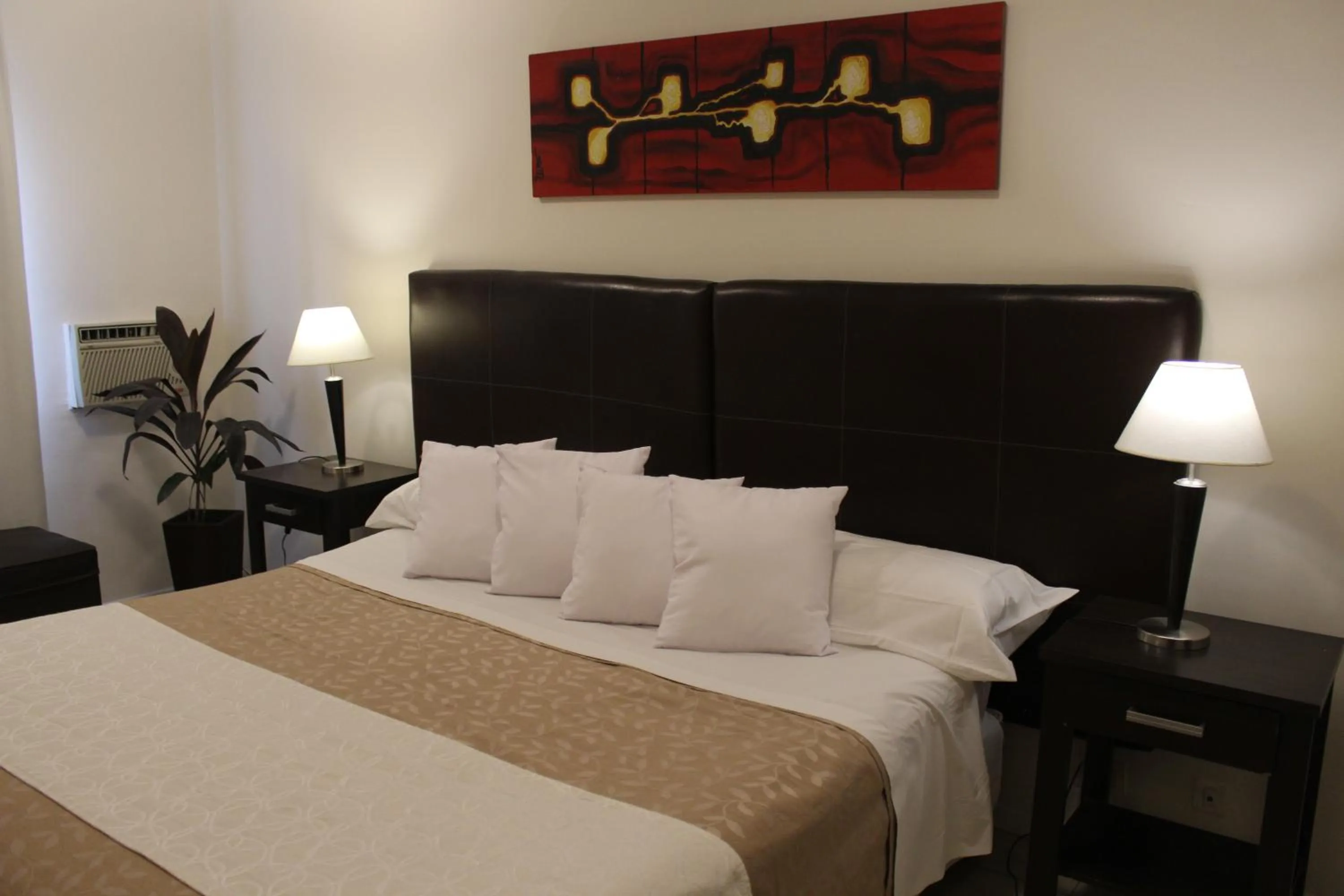 Bed in Uvas Apart Hotel
