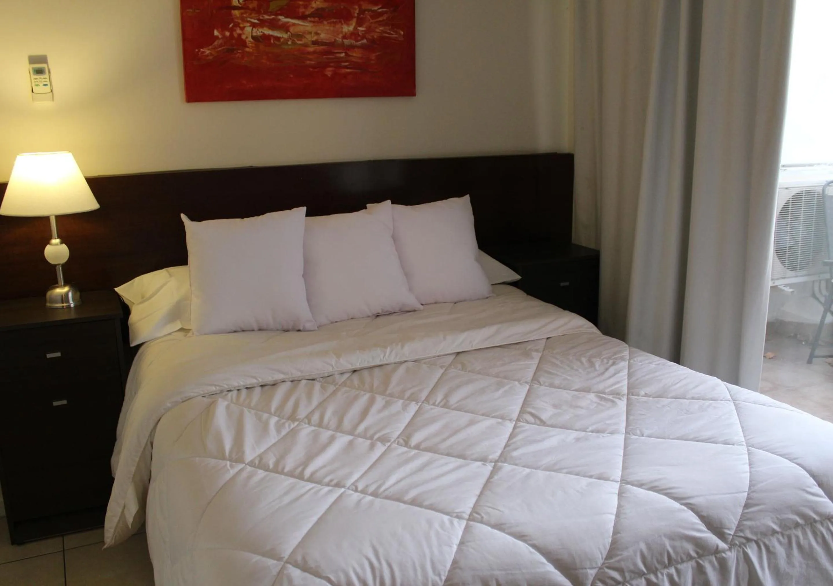 Bed in Uvas Apart Hotel