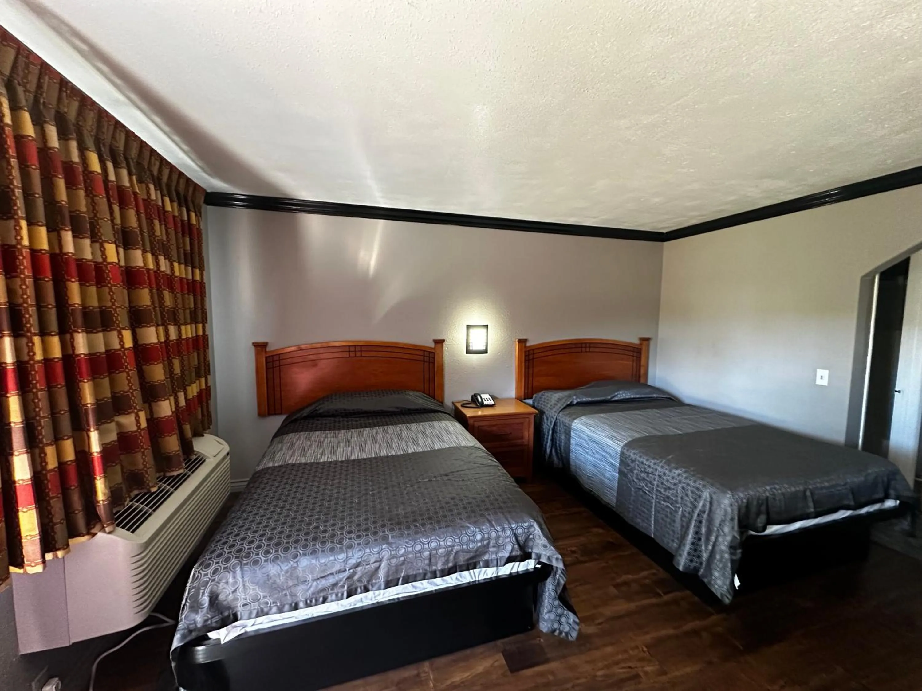 Bedroom, Bed in Sunpark Inn & Suites