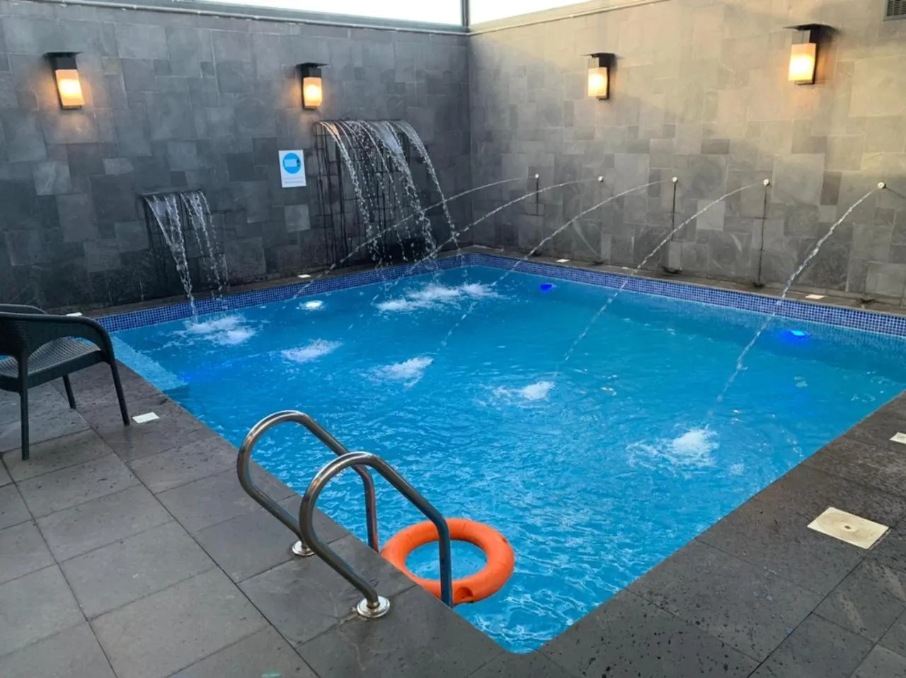 Swimming pool in Bram Suites