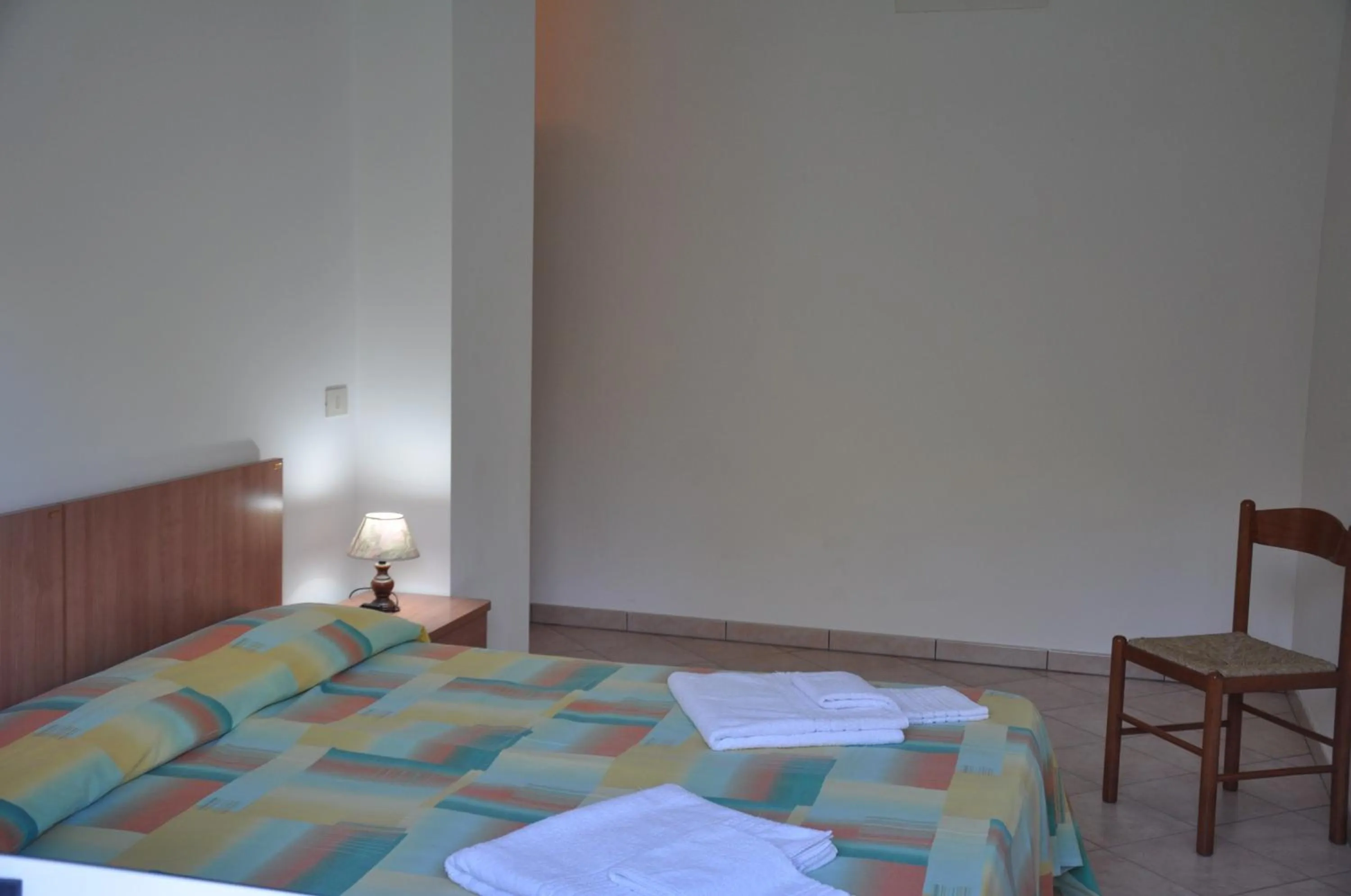 Bed in Rosy Hotel Residence