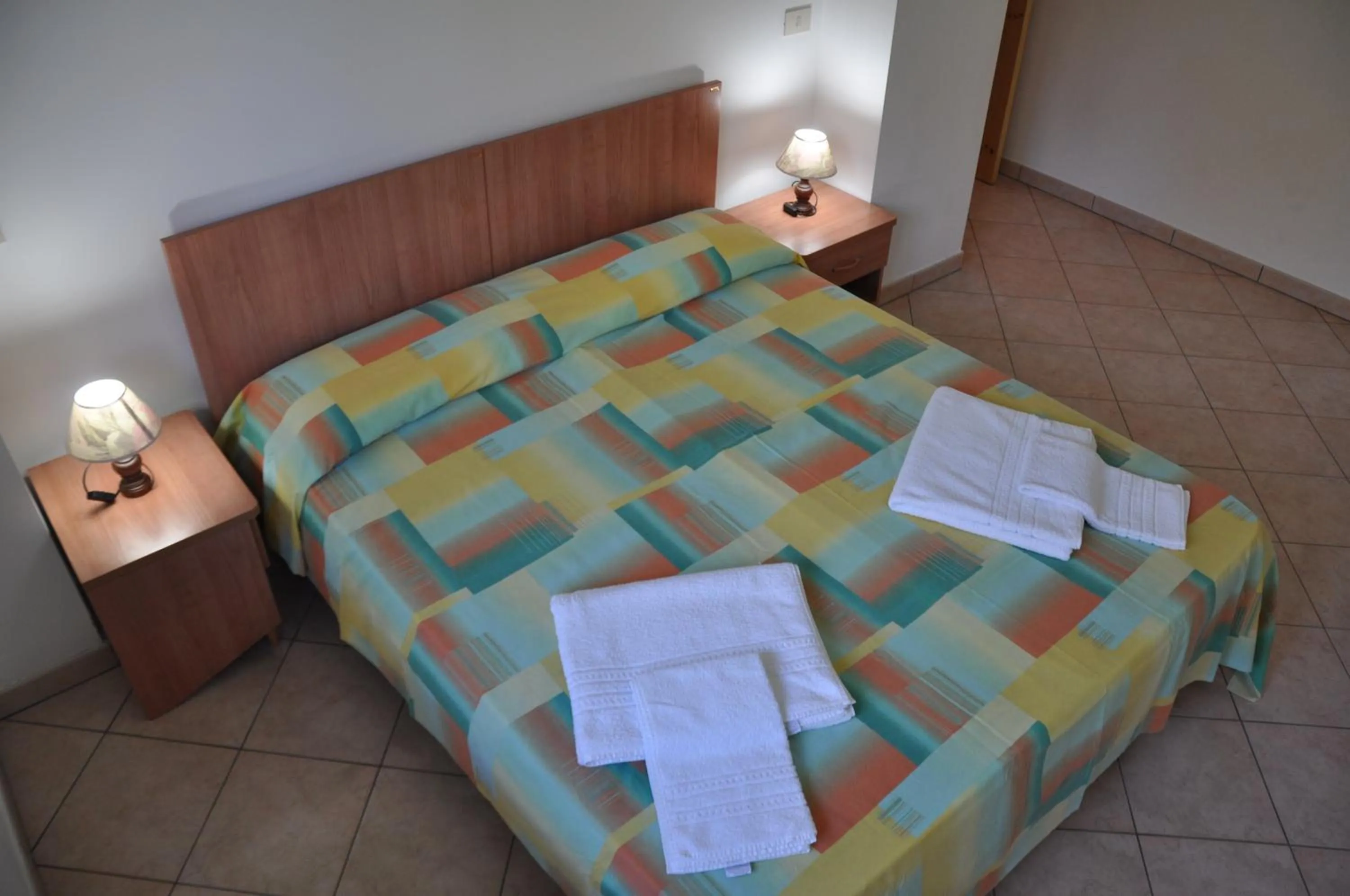 Bed in Rosy Hotel Residence