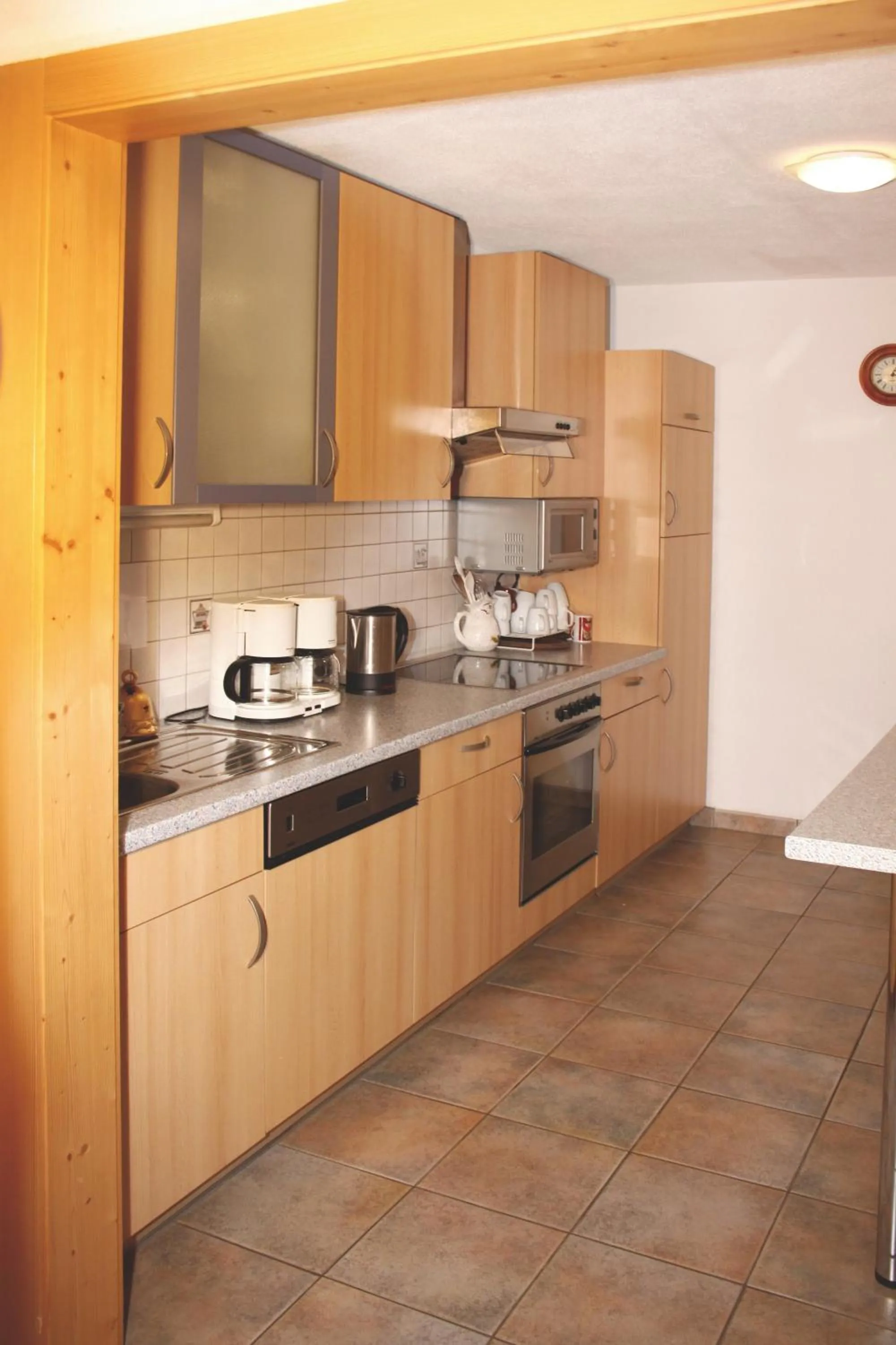 Kitchen or kitchenette in Gästehaus Schwoagerhof