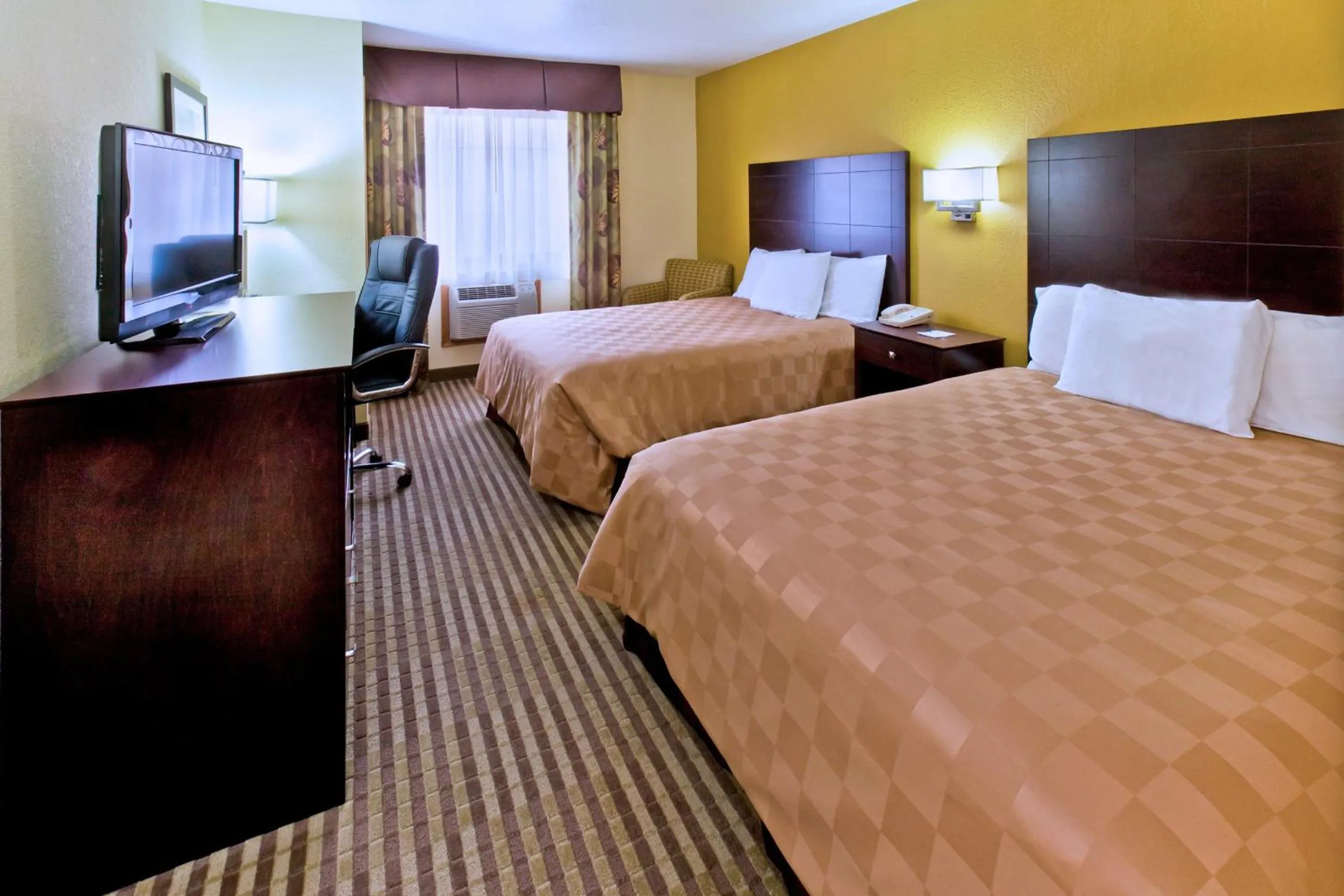 Bedroom, Bed in AmericInn by Wyndham Council Bluffs