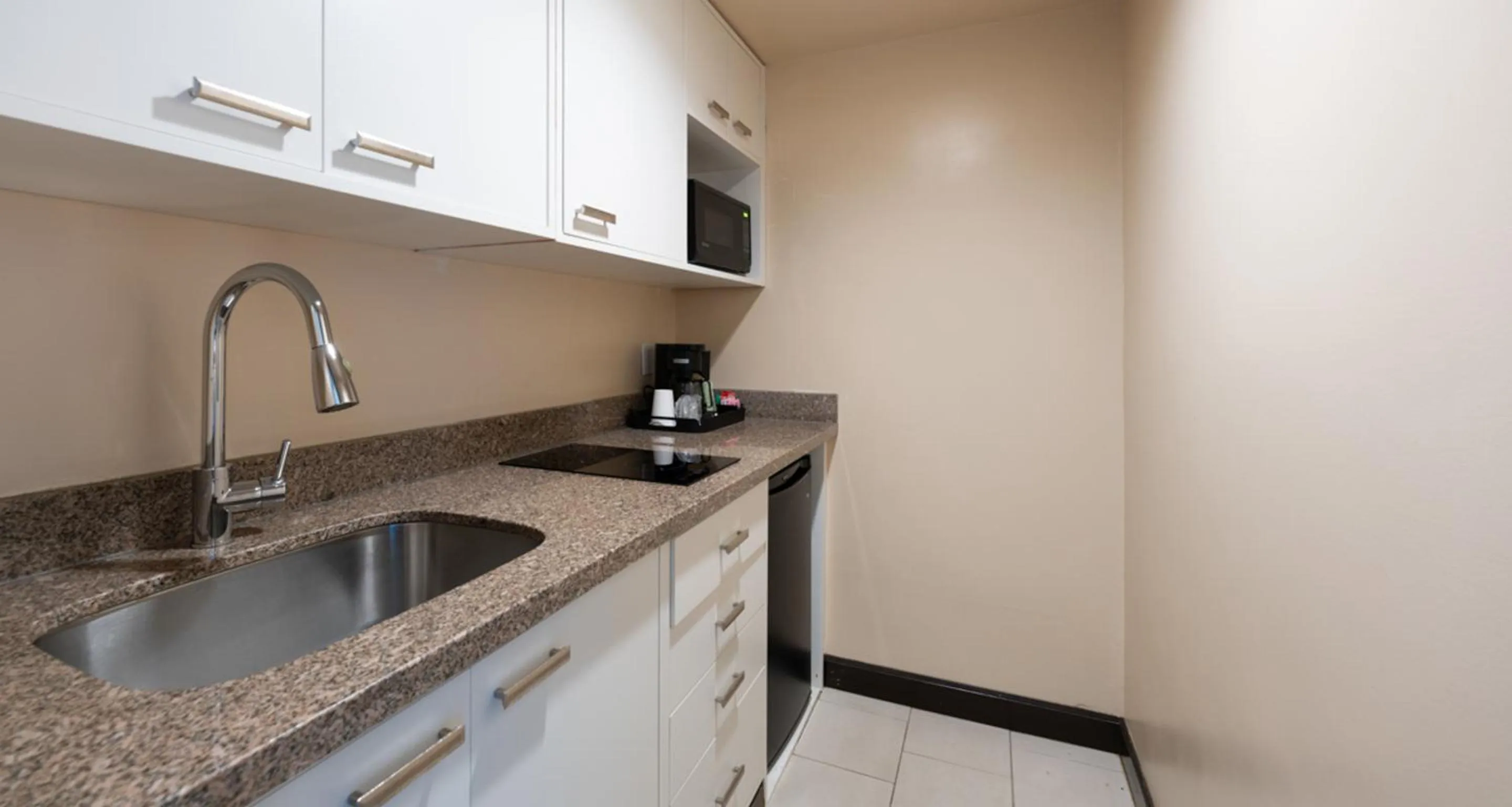 Kitchen or kitchenette in Prestige Oceanview Hotel Prince Rupert