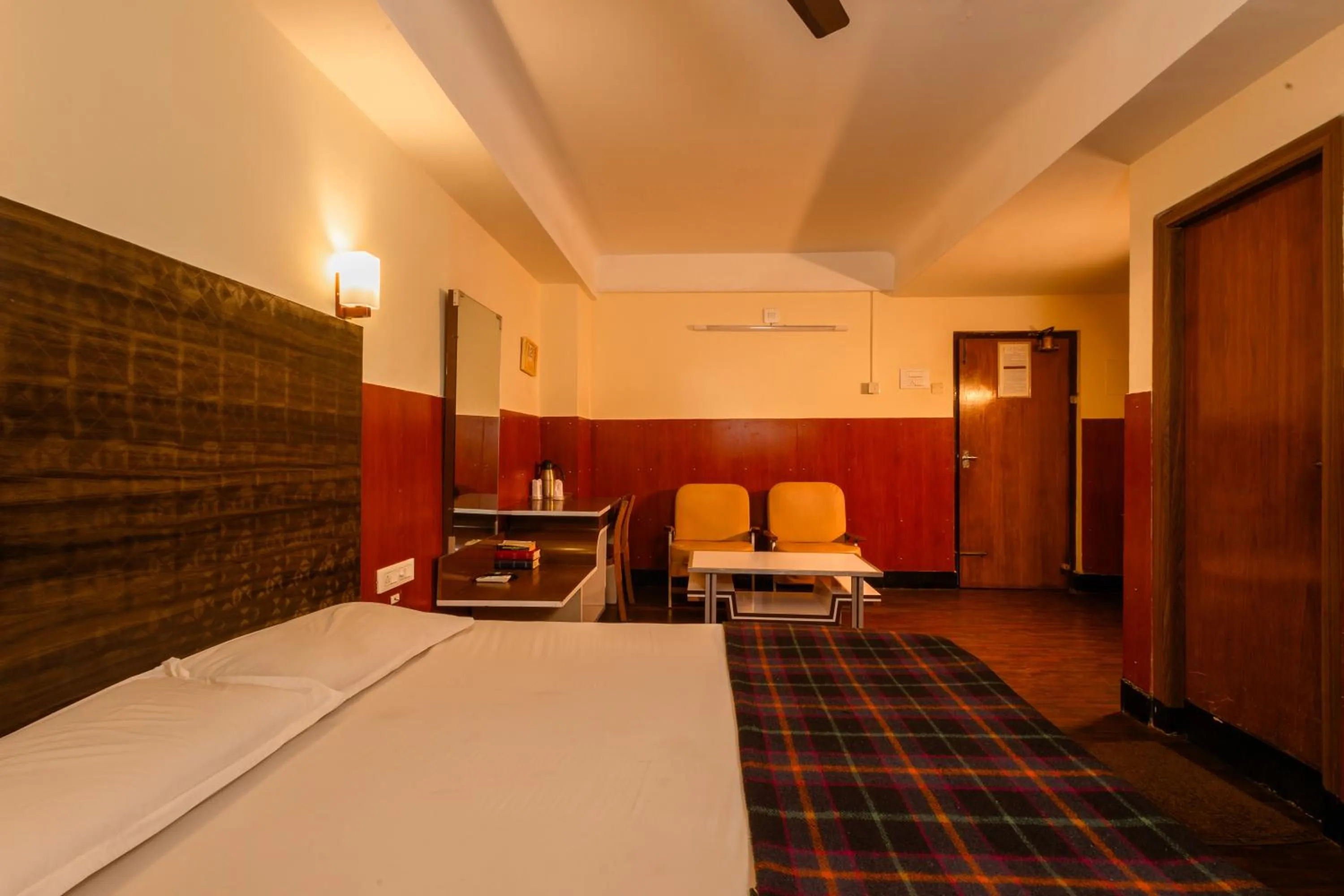 Seating area, Bed in Hotel Srilakshmi