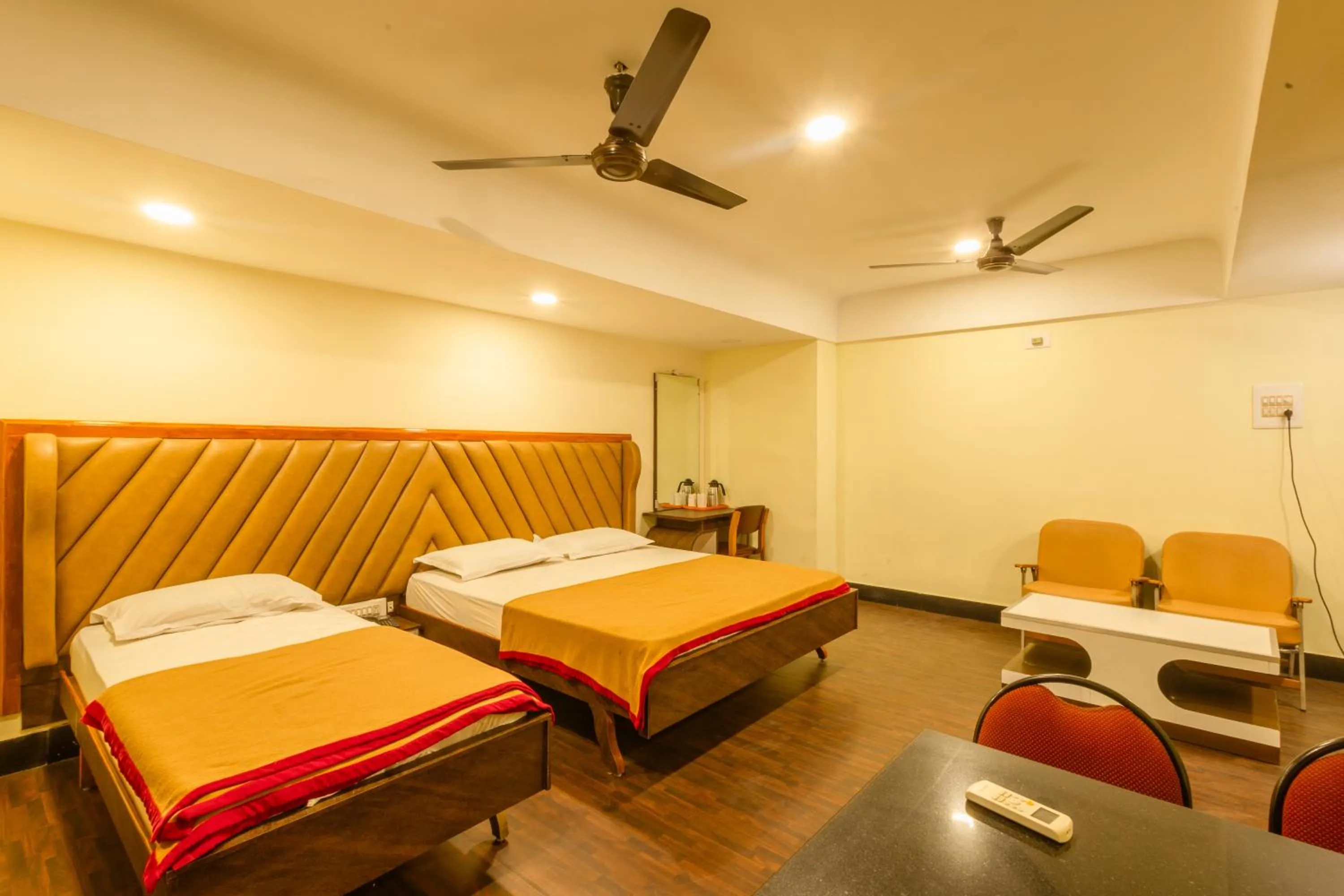 Seating area, Bed in Hotel Srilakshmi