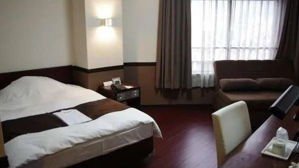 Bed in Hotel Saint Paul Nagasaki