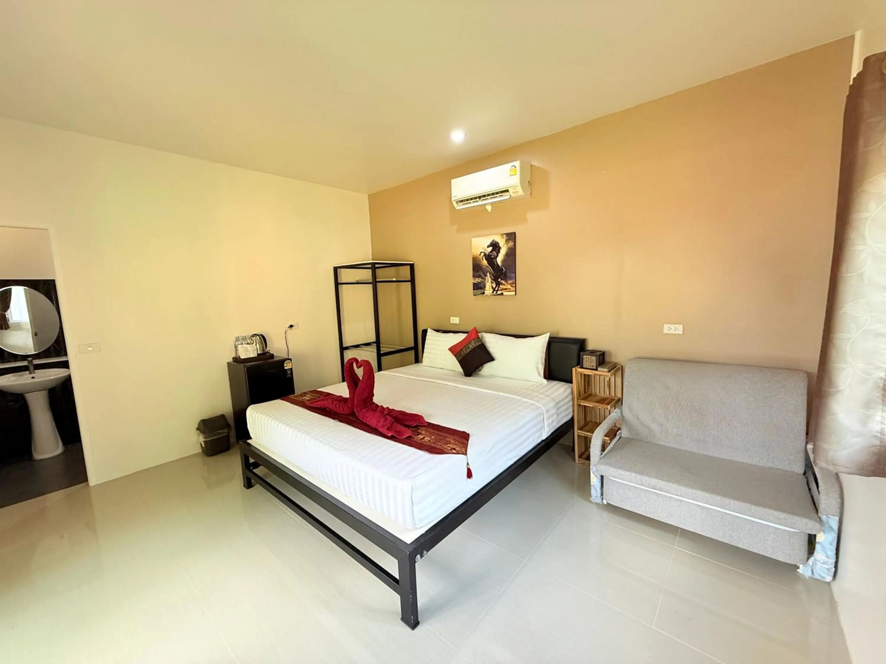 Bed in Lanta Palm Beach Resort , Beach Bungalow - Koh Lanta