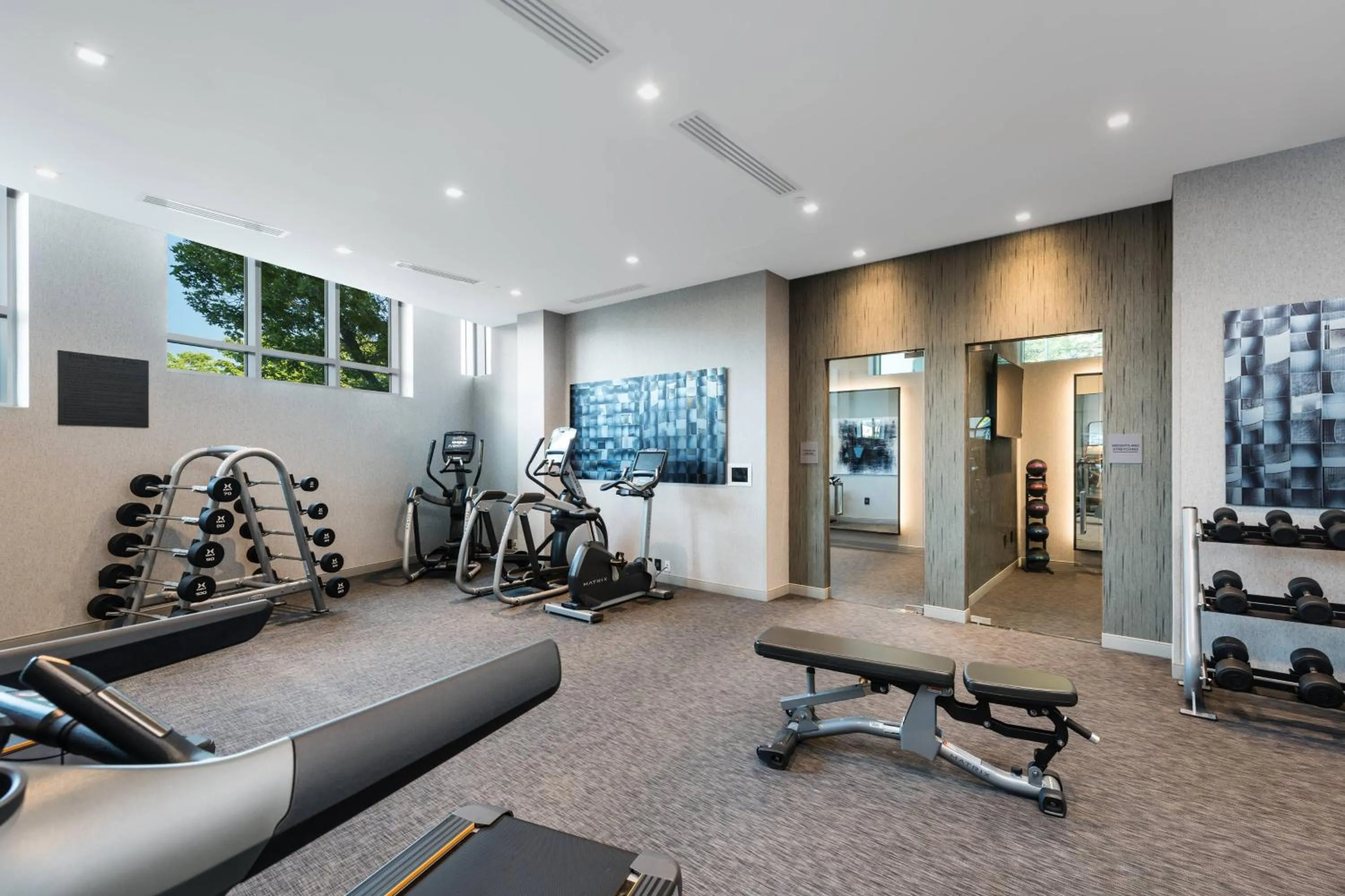 Fitness centre/facilities in AC Hotel by Marriott Boston Cleveland Circle