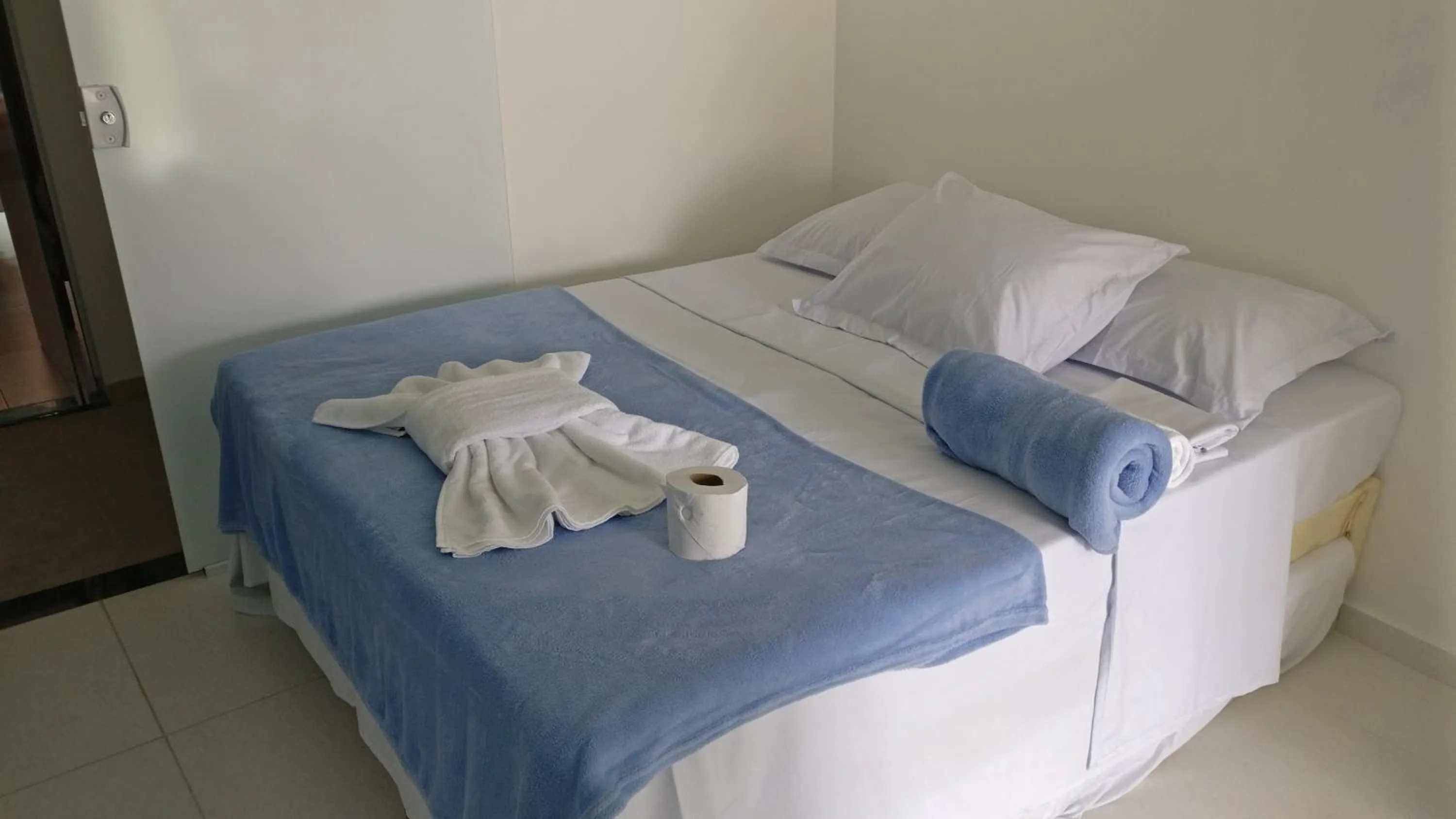 Bed in Xodó do Peró Suítes