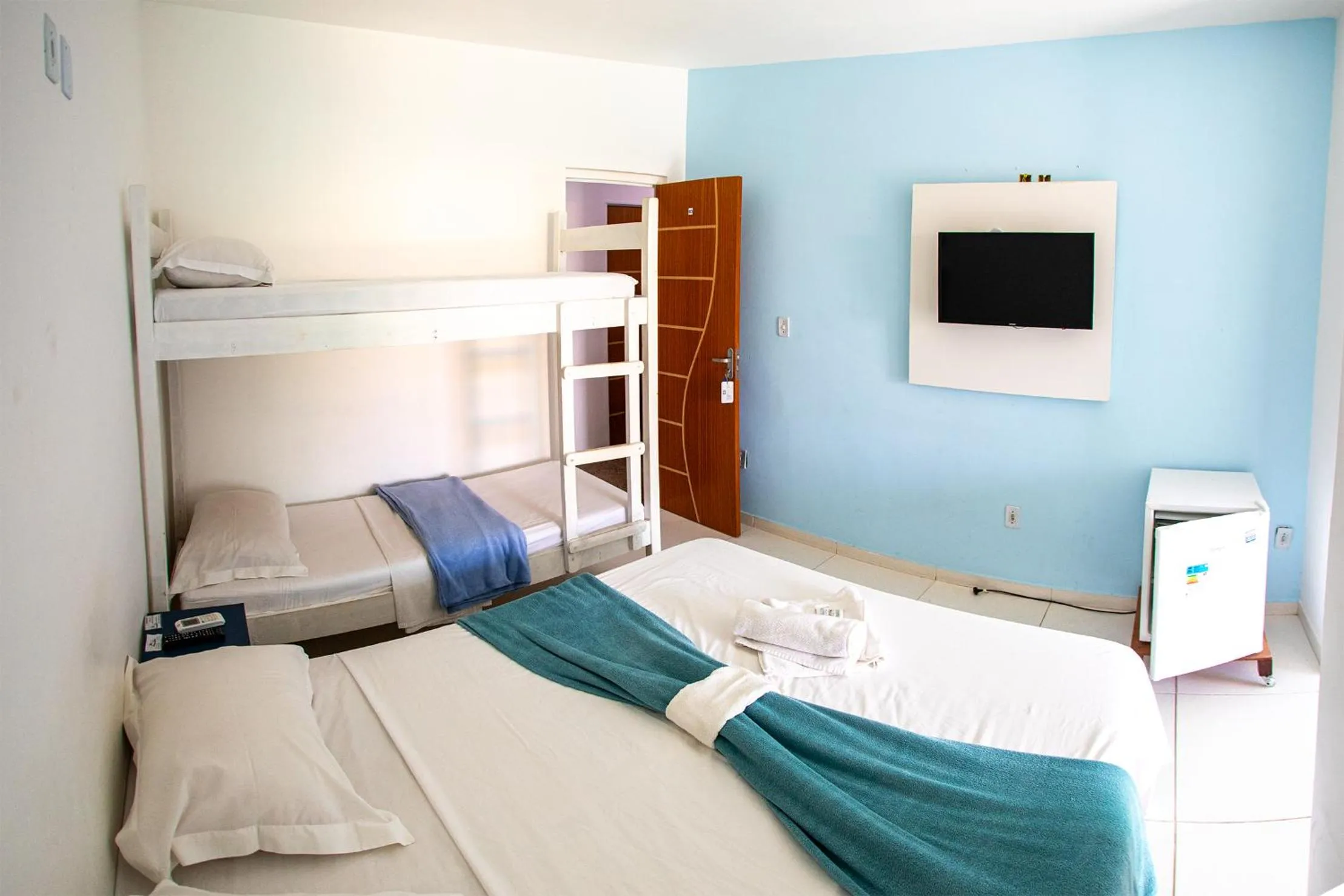 Bed in Xodó do Peró Suítes