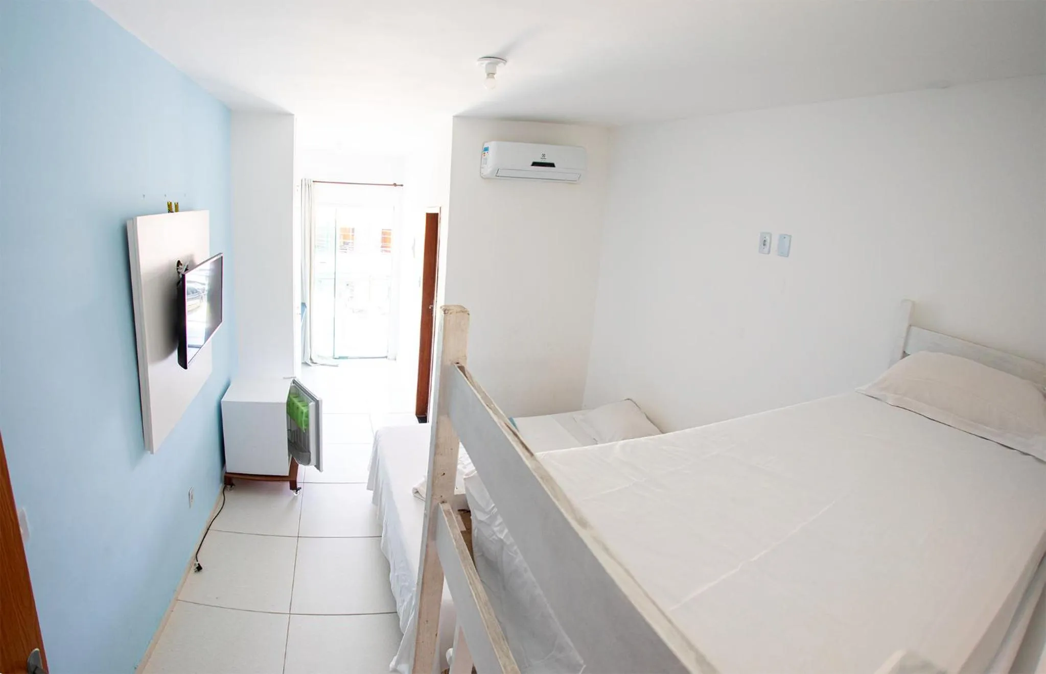 Bed in Xodó do Peró Suítes