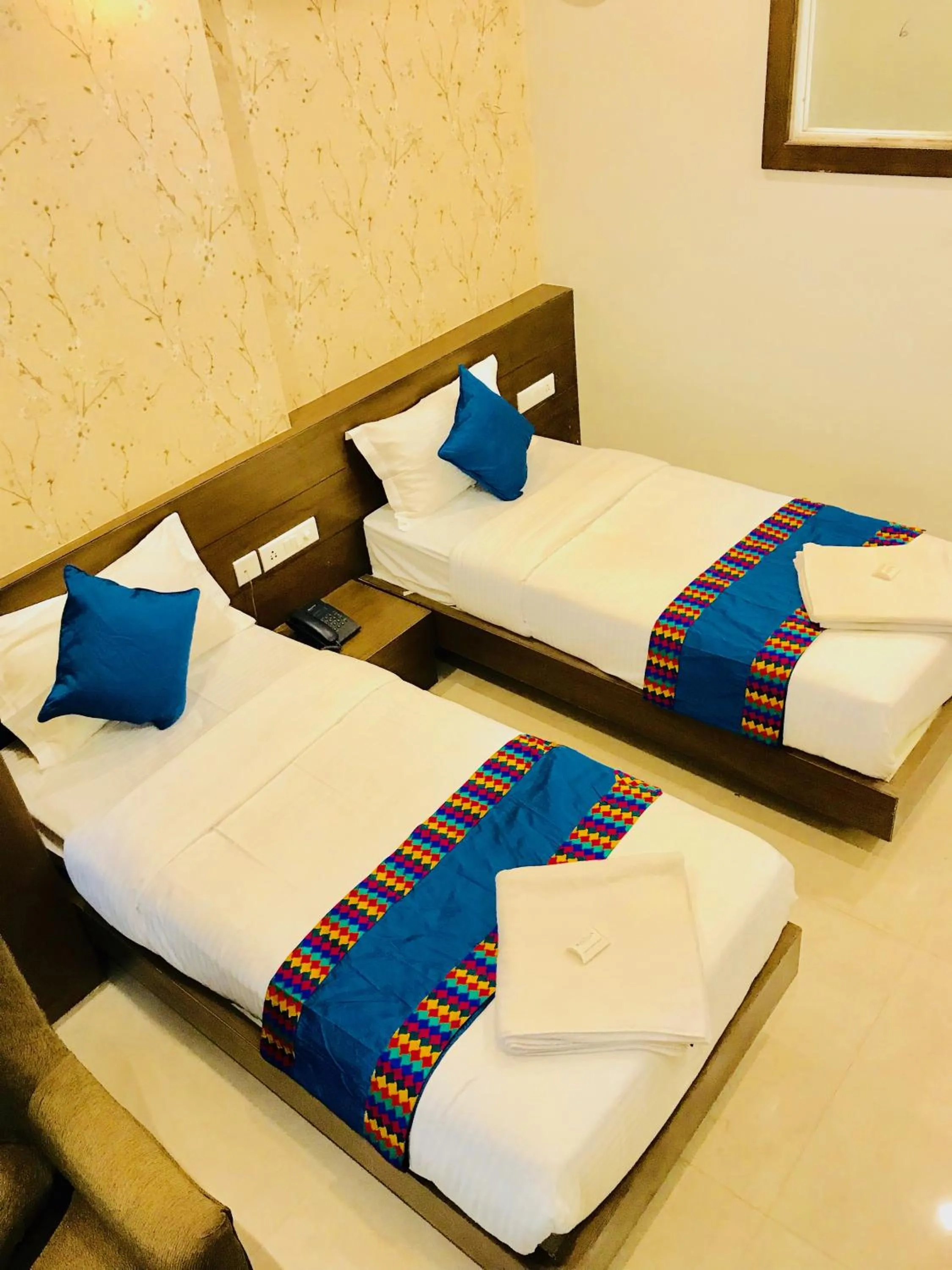 Toilet, Bed in REGALIA INN &SUITES