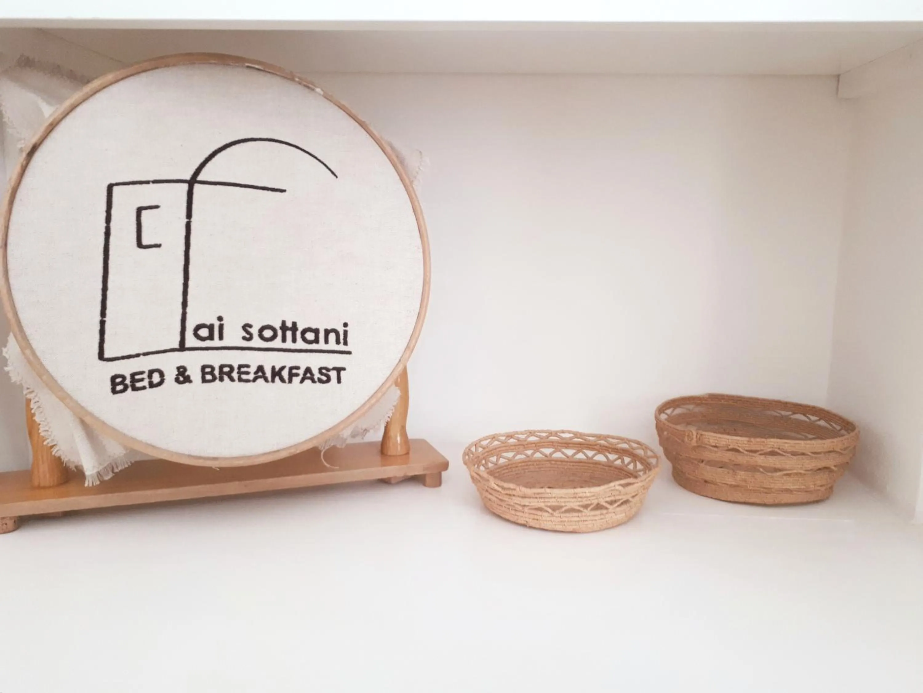 Property logo or sign in Ai Sottani B&B Deluxe Suite