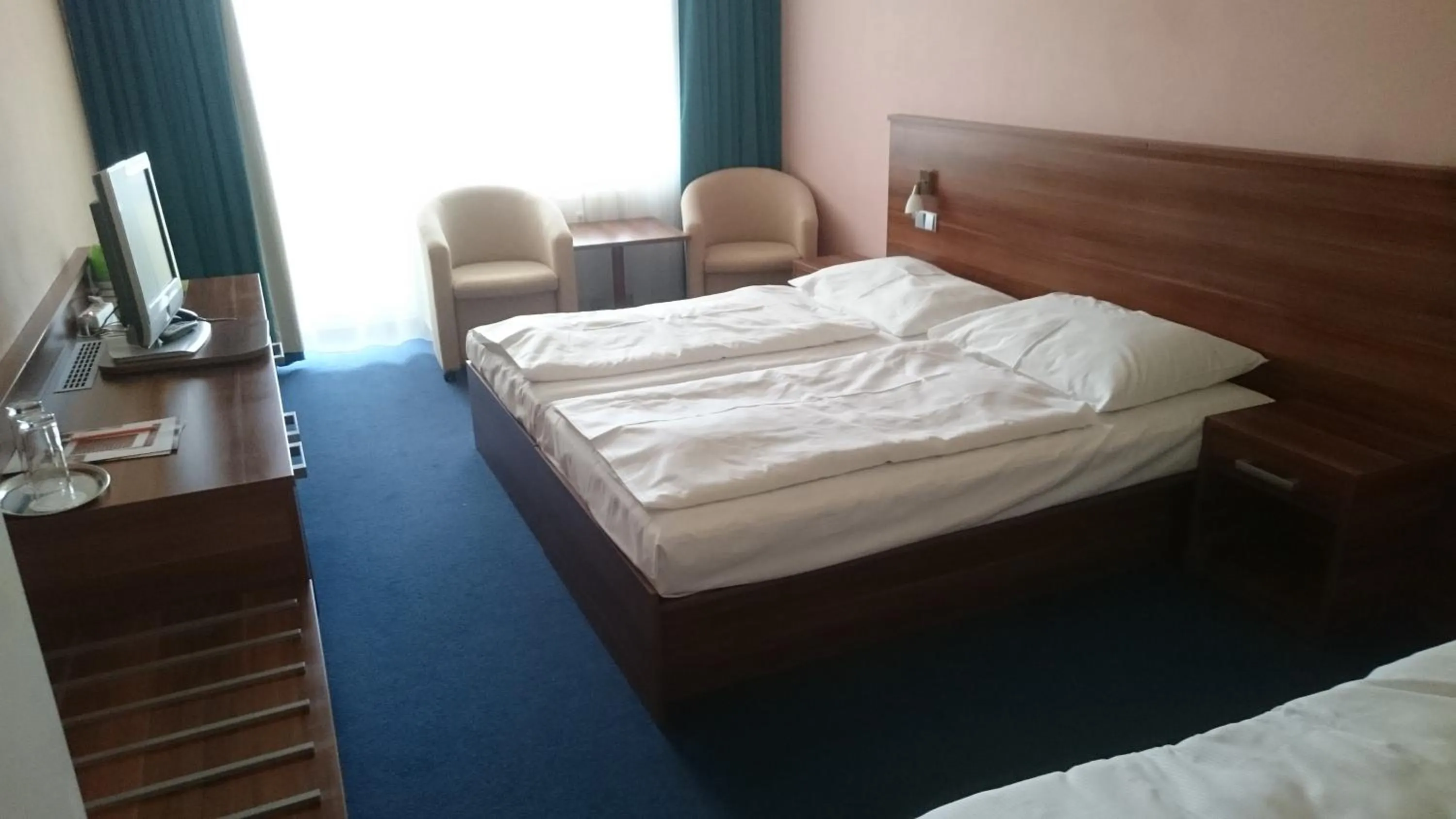 Bed in LIPNO WELLNESS - FRYMBURK HOTEL private family room