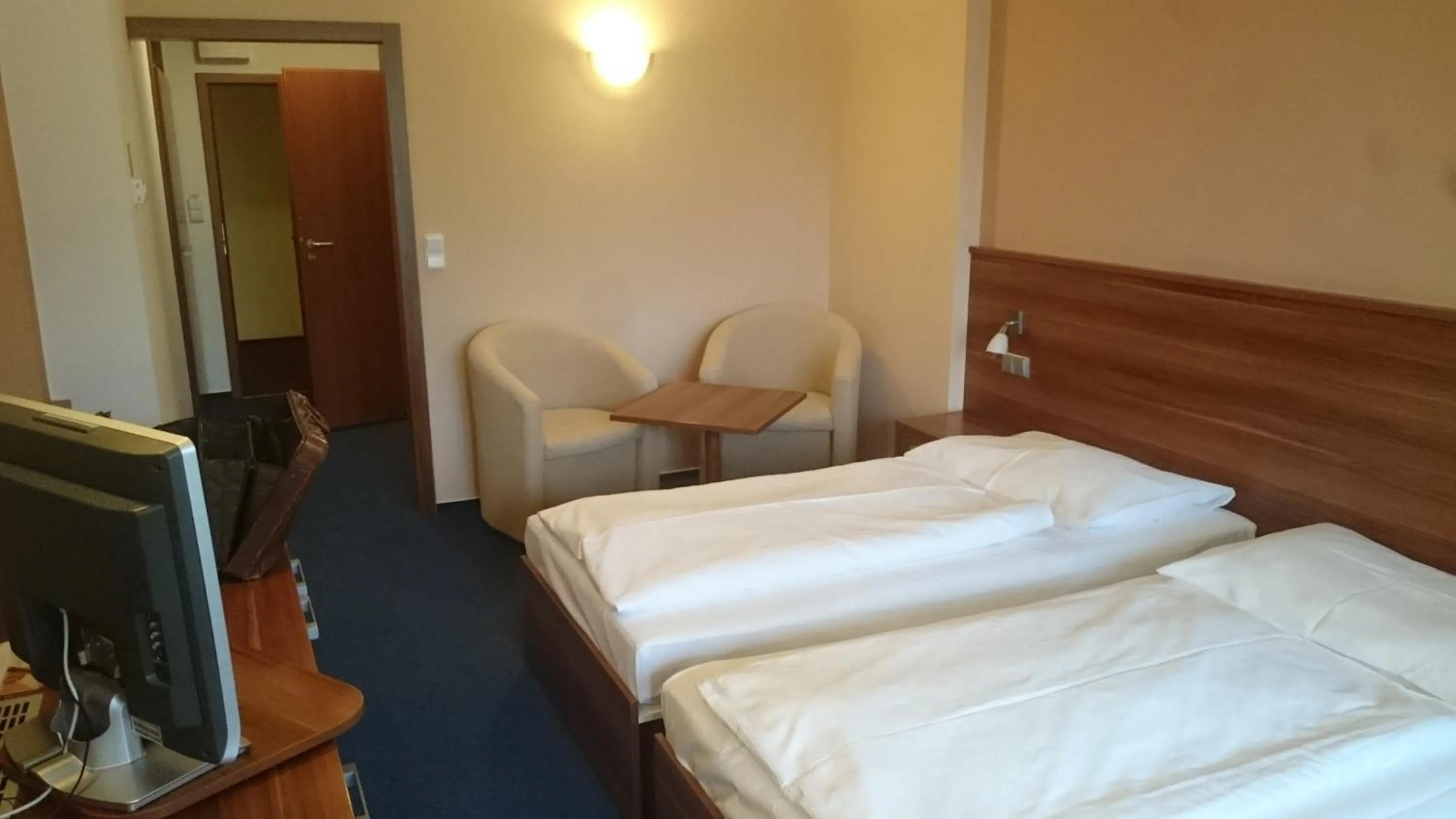 Bed in LIPNO WELLNESS - FRYMBURK HOTEL private family room