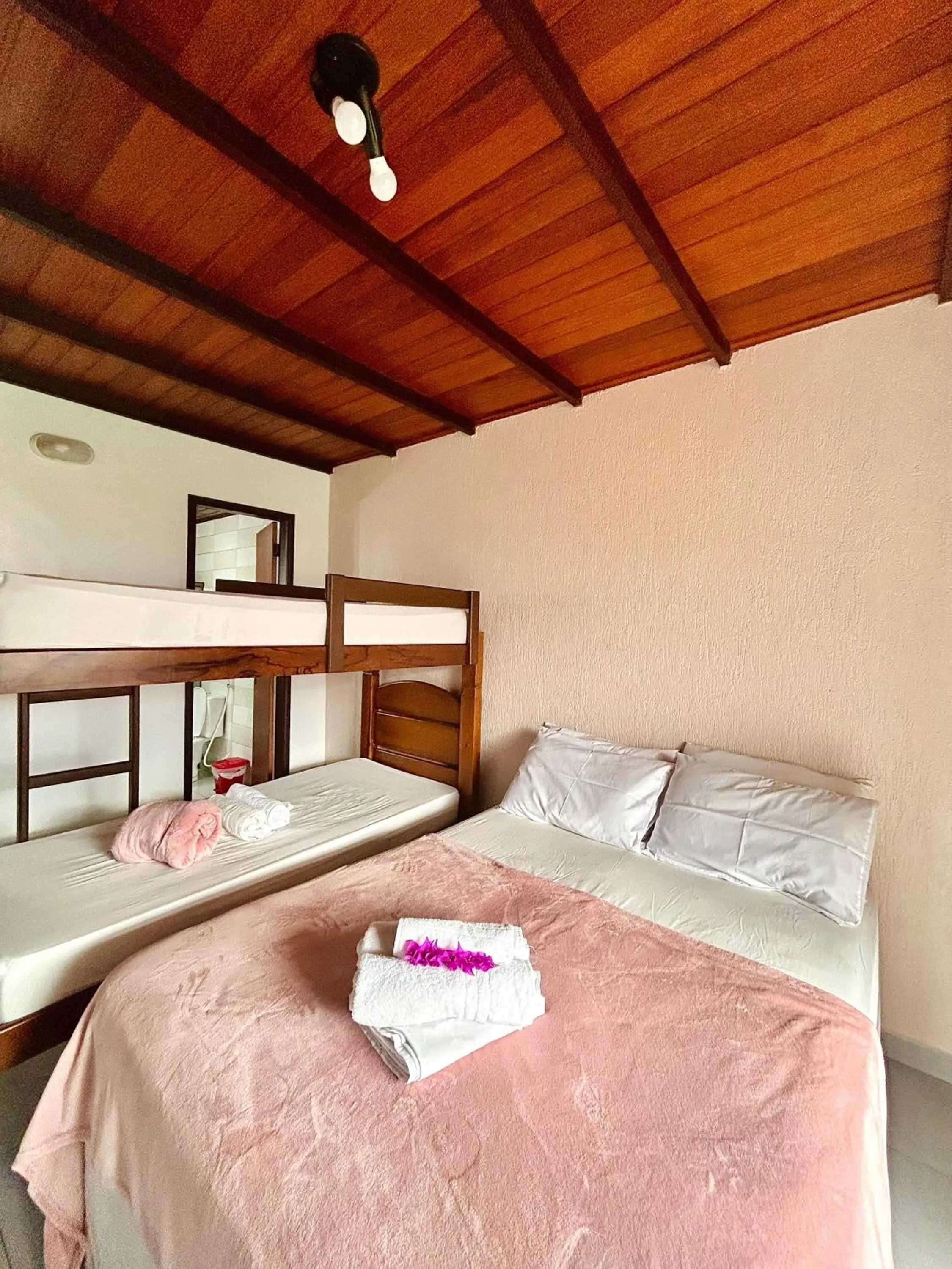 Bed in Bougainville Suítes