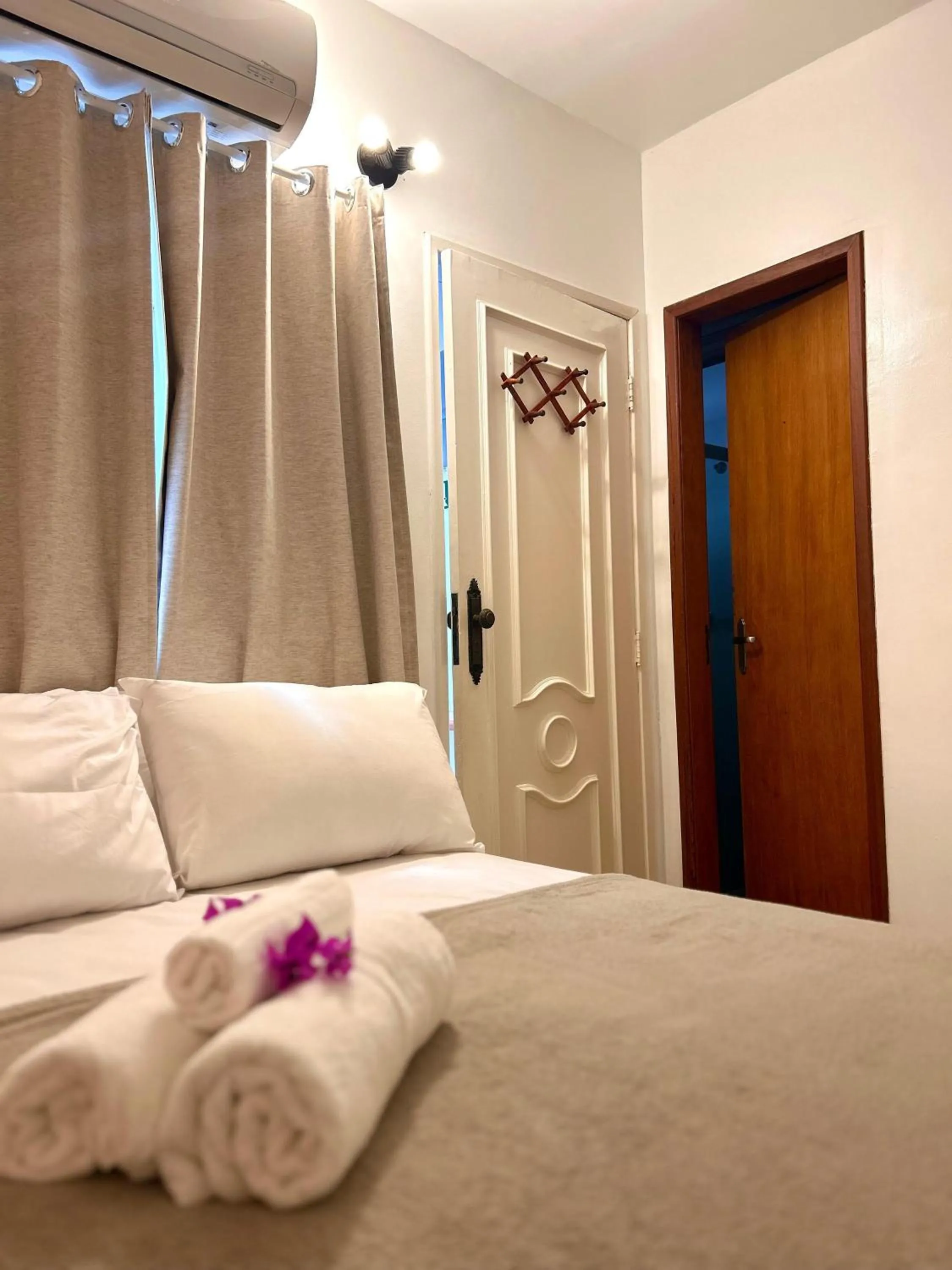 Bed in Bougainville Suítes