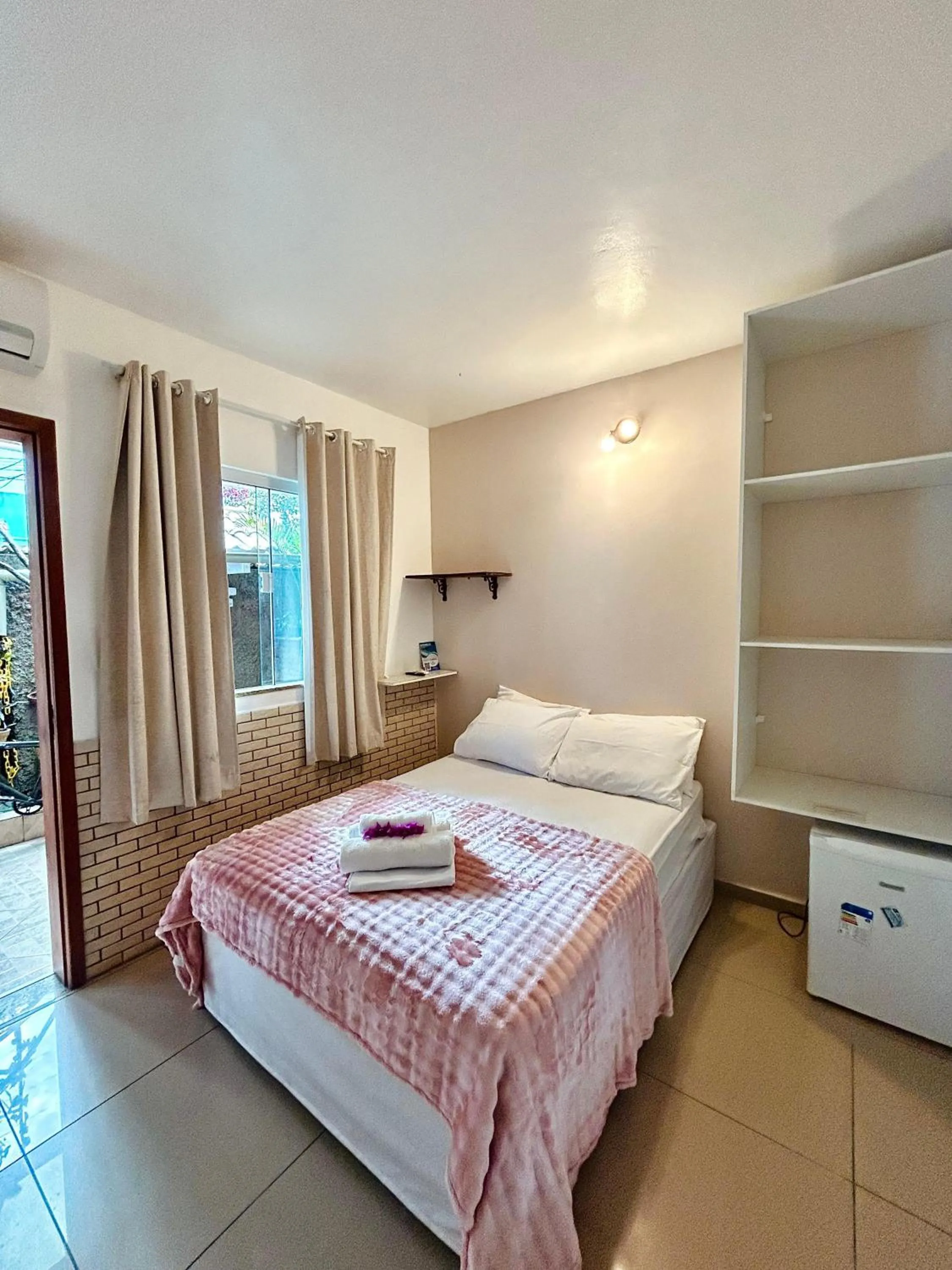 Bed in Bougainville Suítes