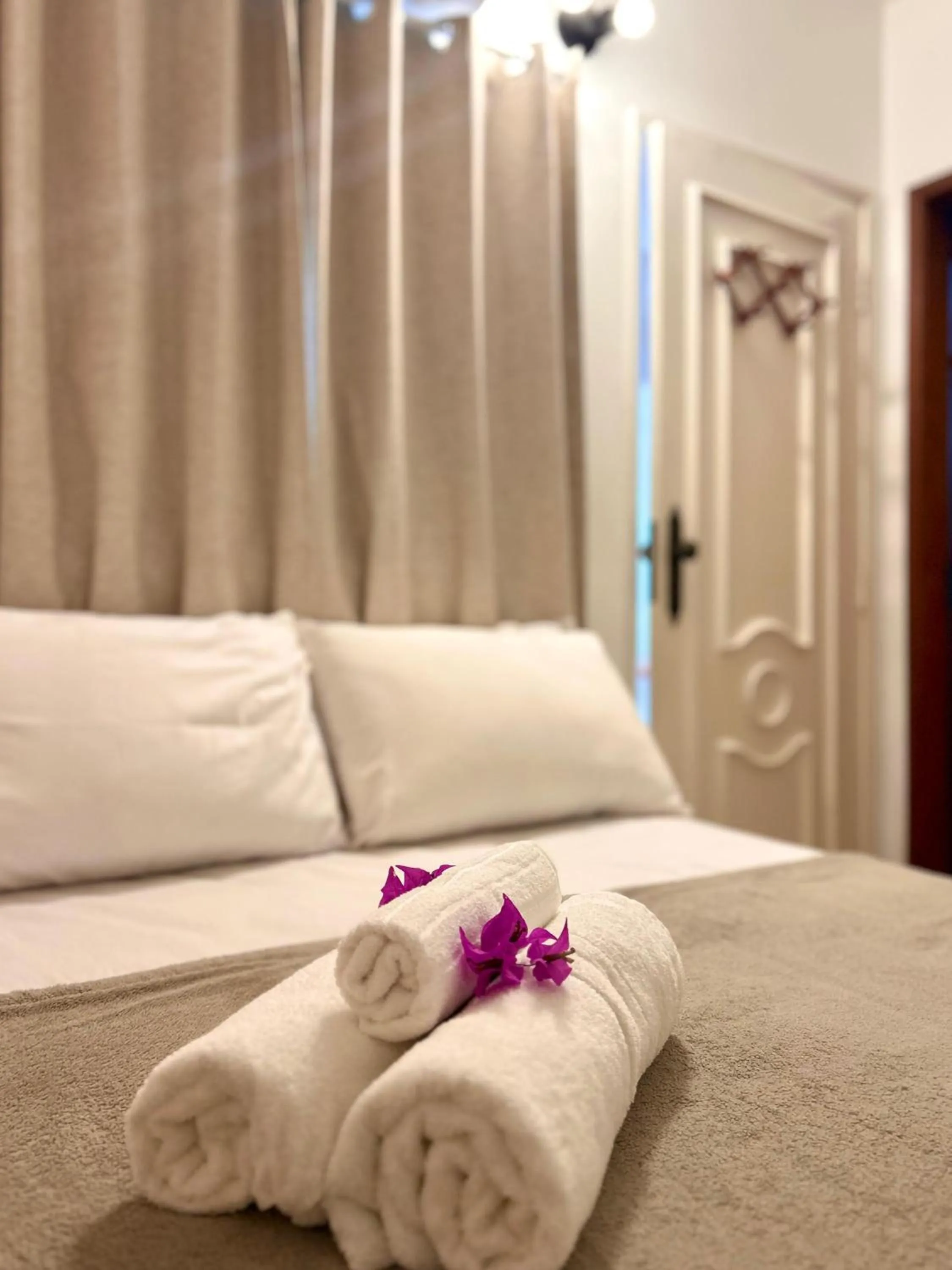 Bed in Bougainville Suítes