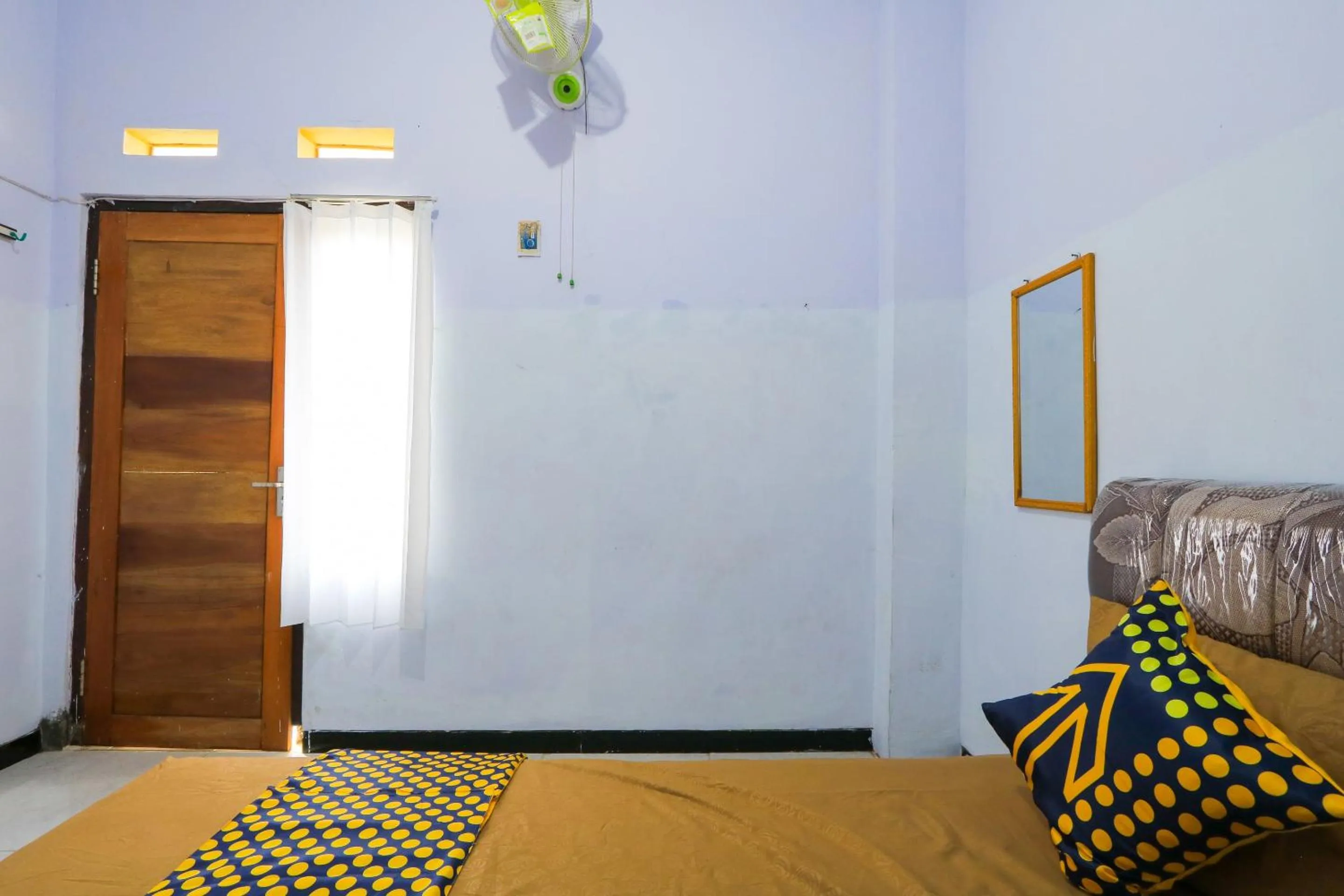 Bedroom in OYO 2497 Pesona Guest House