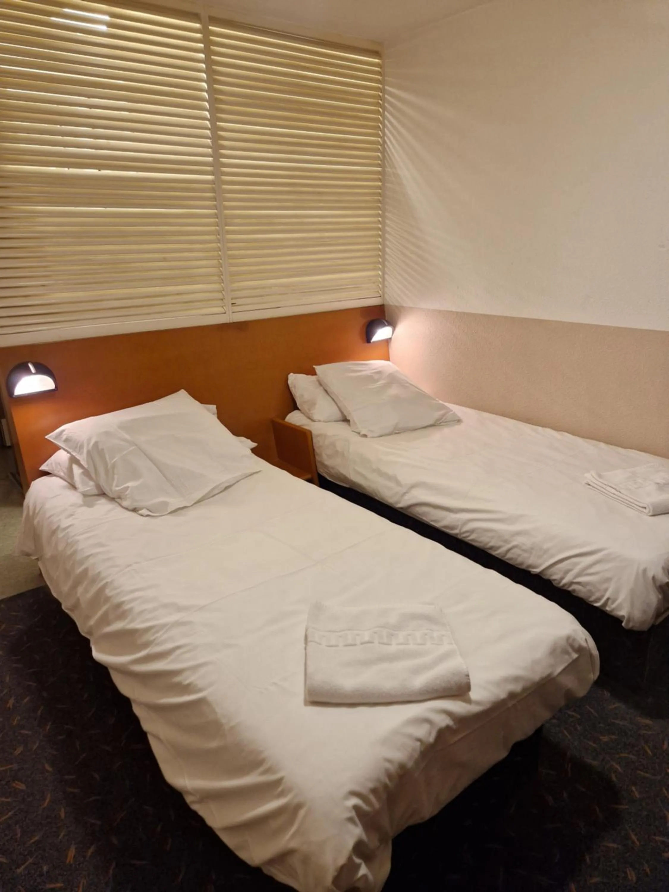 Bed in Quick Palace Vannes