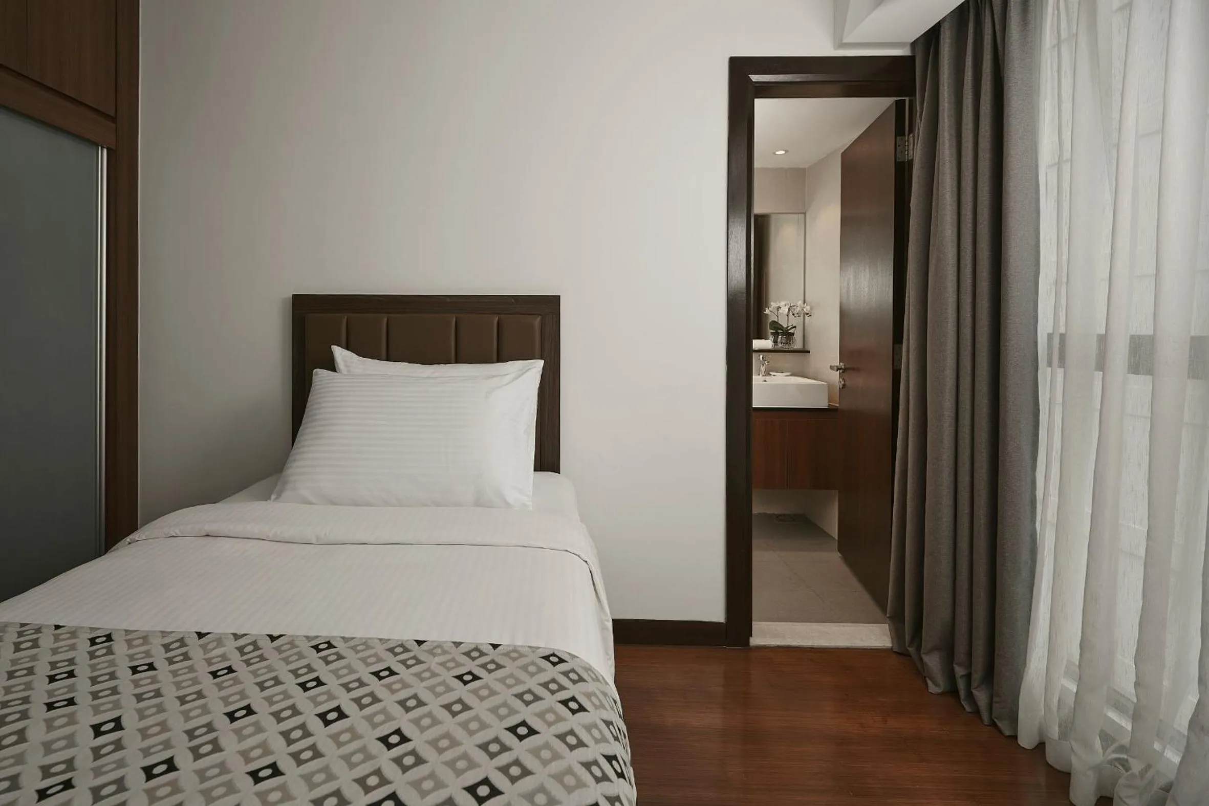 Bed in TRILLION SUITES by SLG