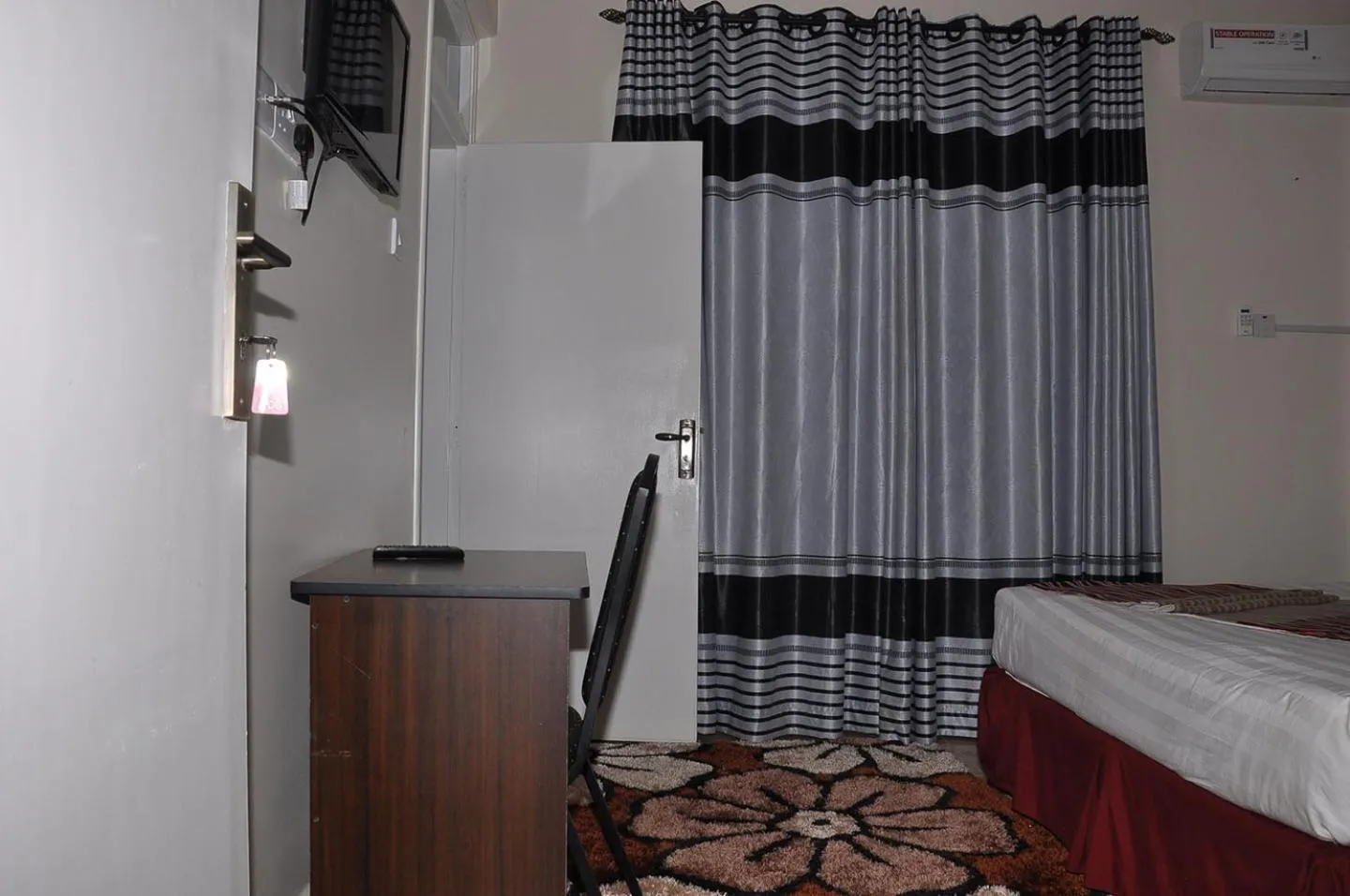 Photo of the whole room, Bed in Latitude 1 Suites