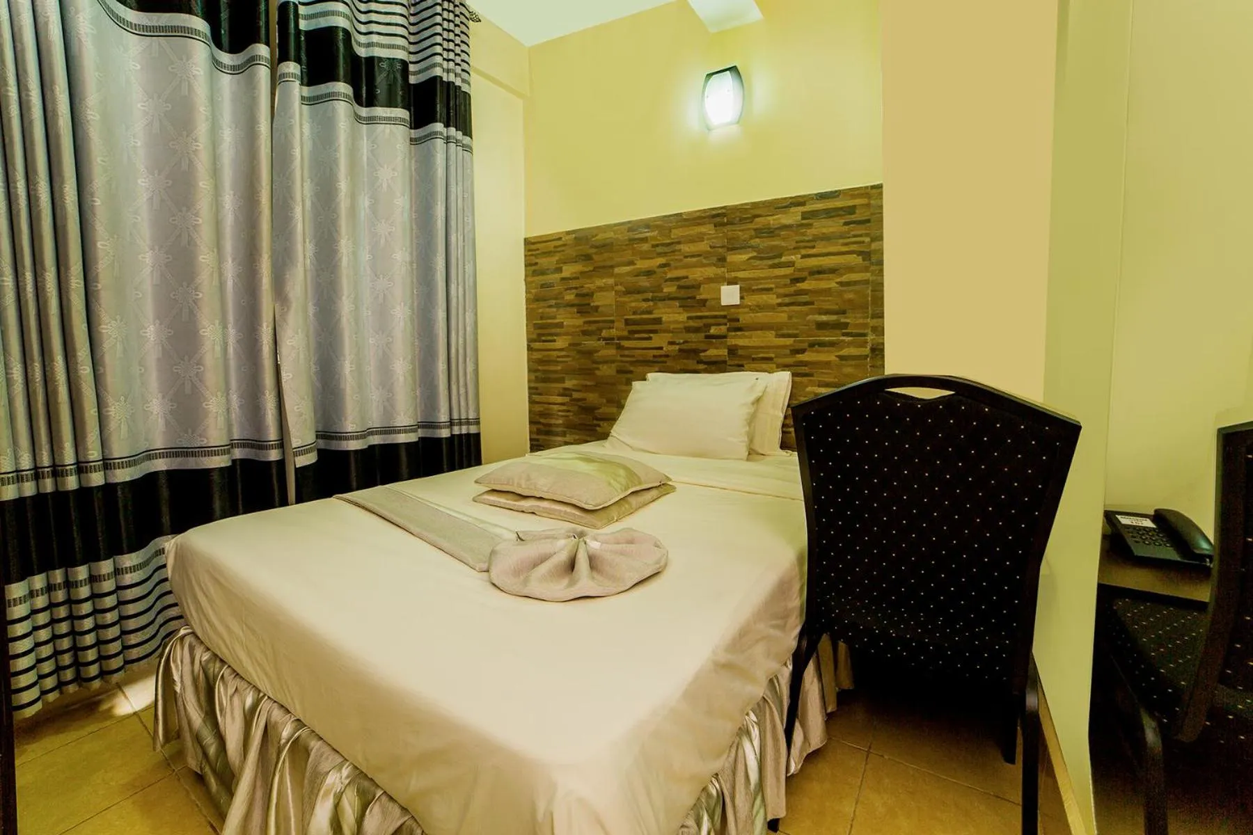 Photo of the whole room, Bed in Latitude 1 Suites