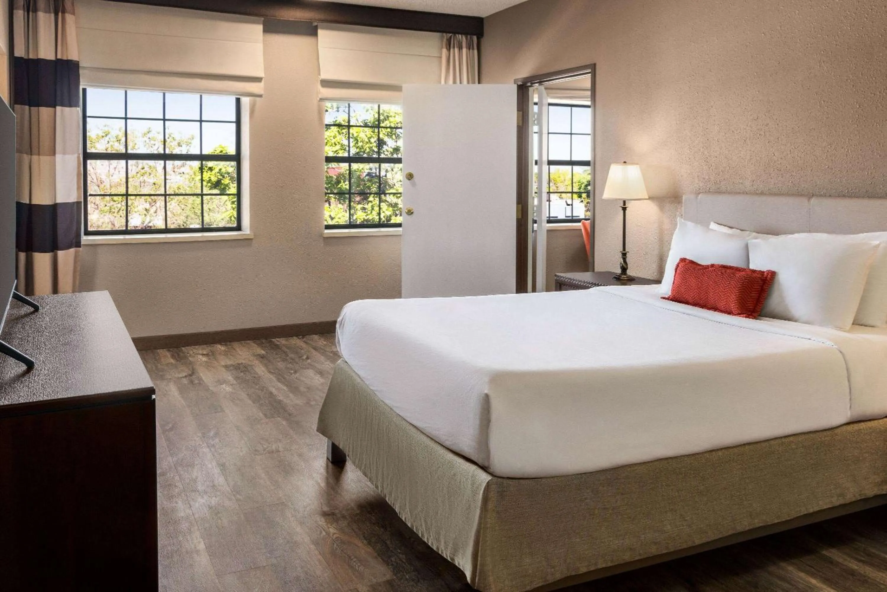 Bed in Ramada by Wyndham Albuquerque Airport