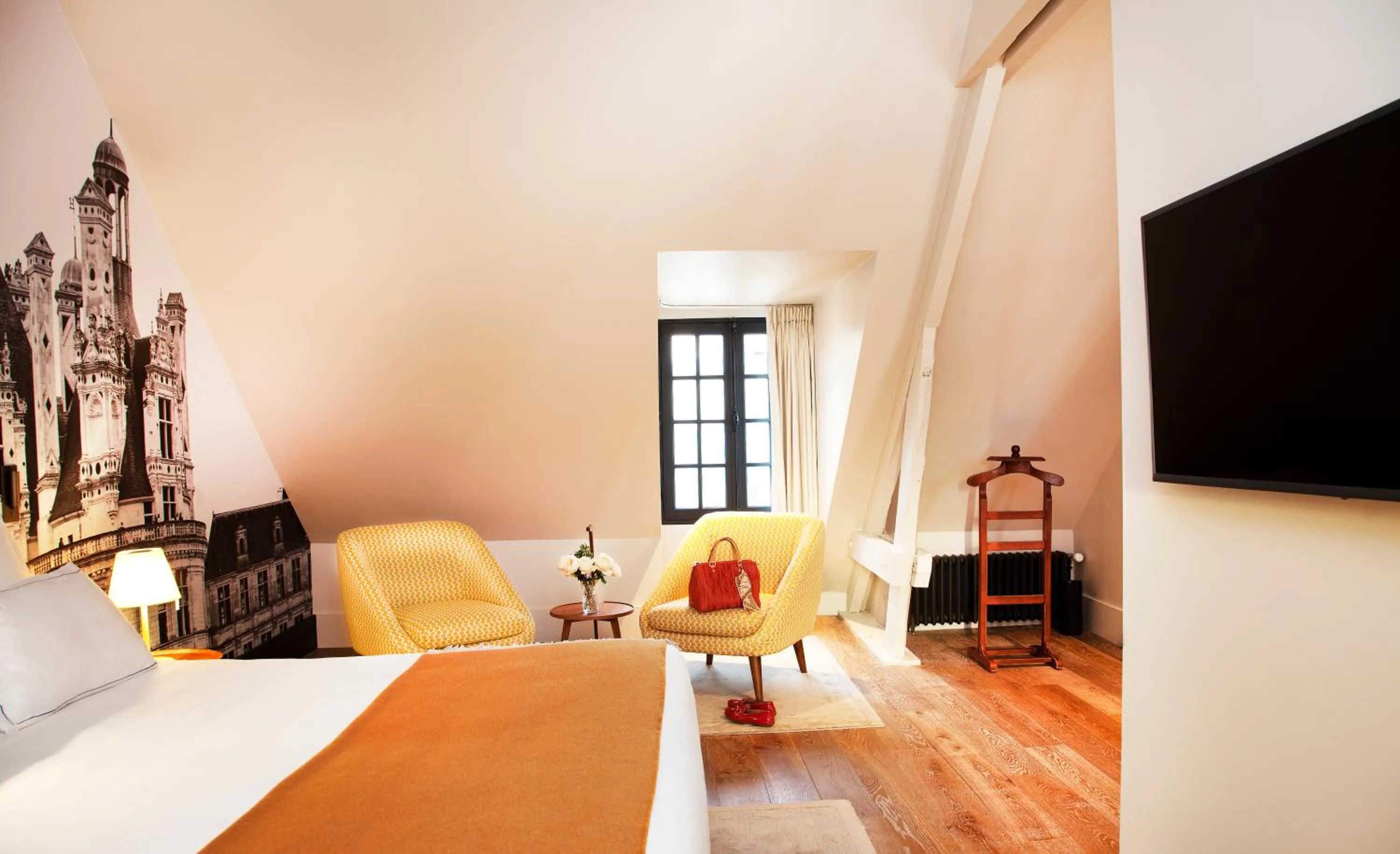 Bed in Relais de Chambord, a Small Luxury Hotels of the World