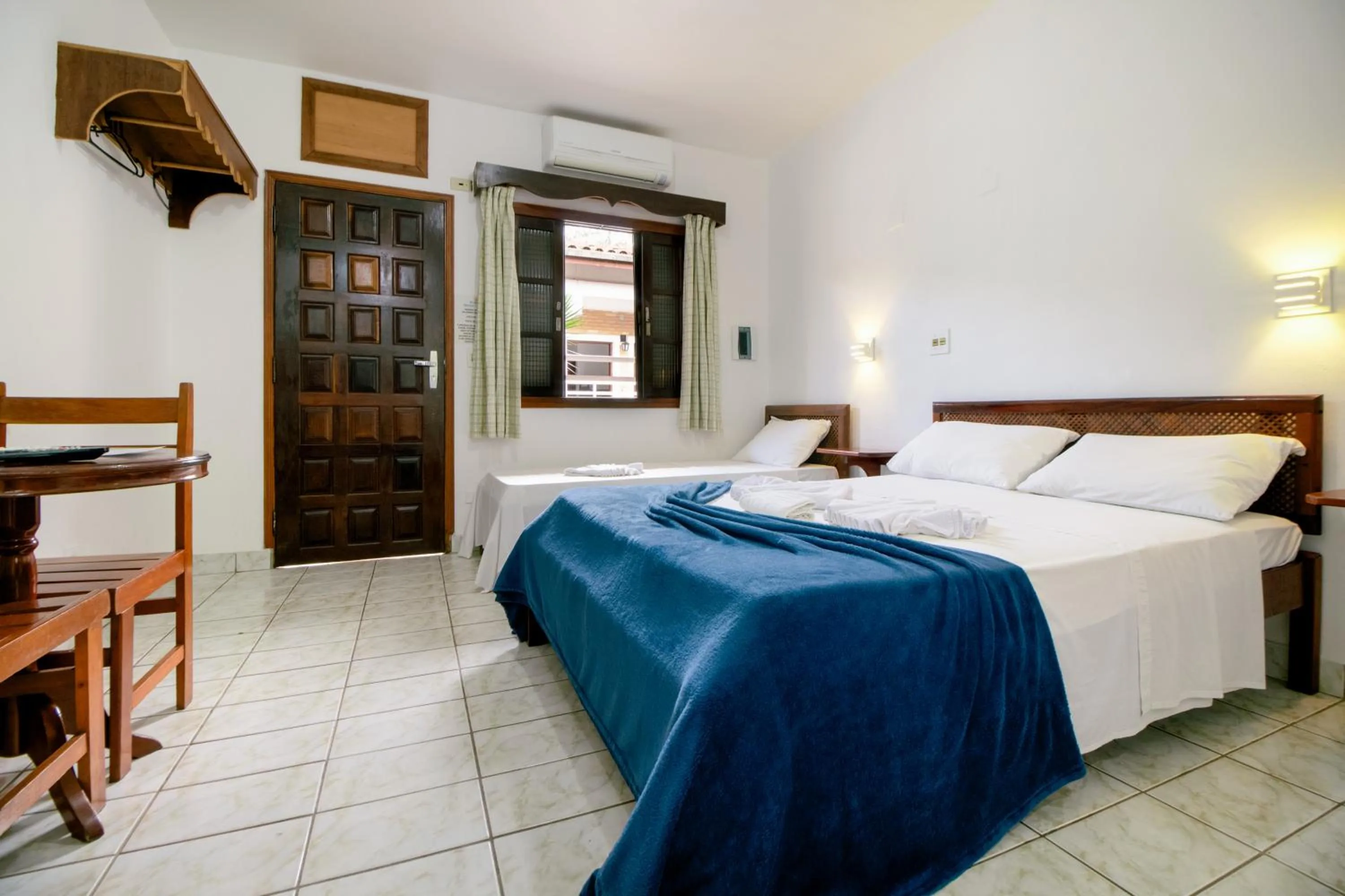 Bed in VELINN Pousada Ubatuba Tropical