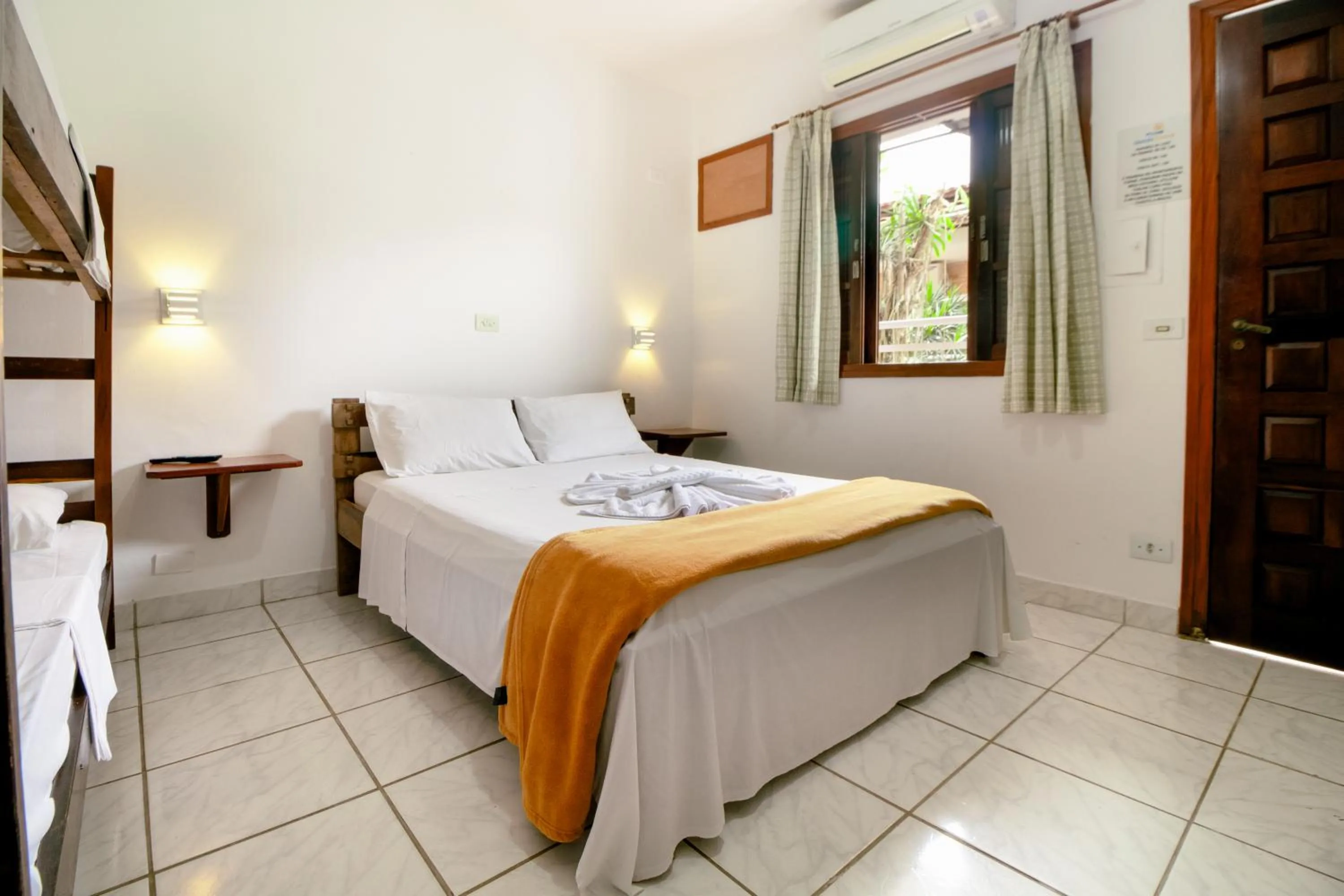 Bed in VELINN Pousada Ubatuba Tropical