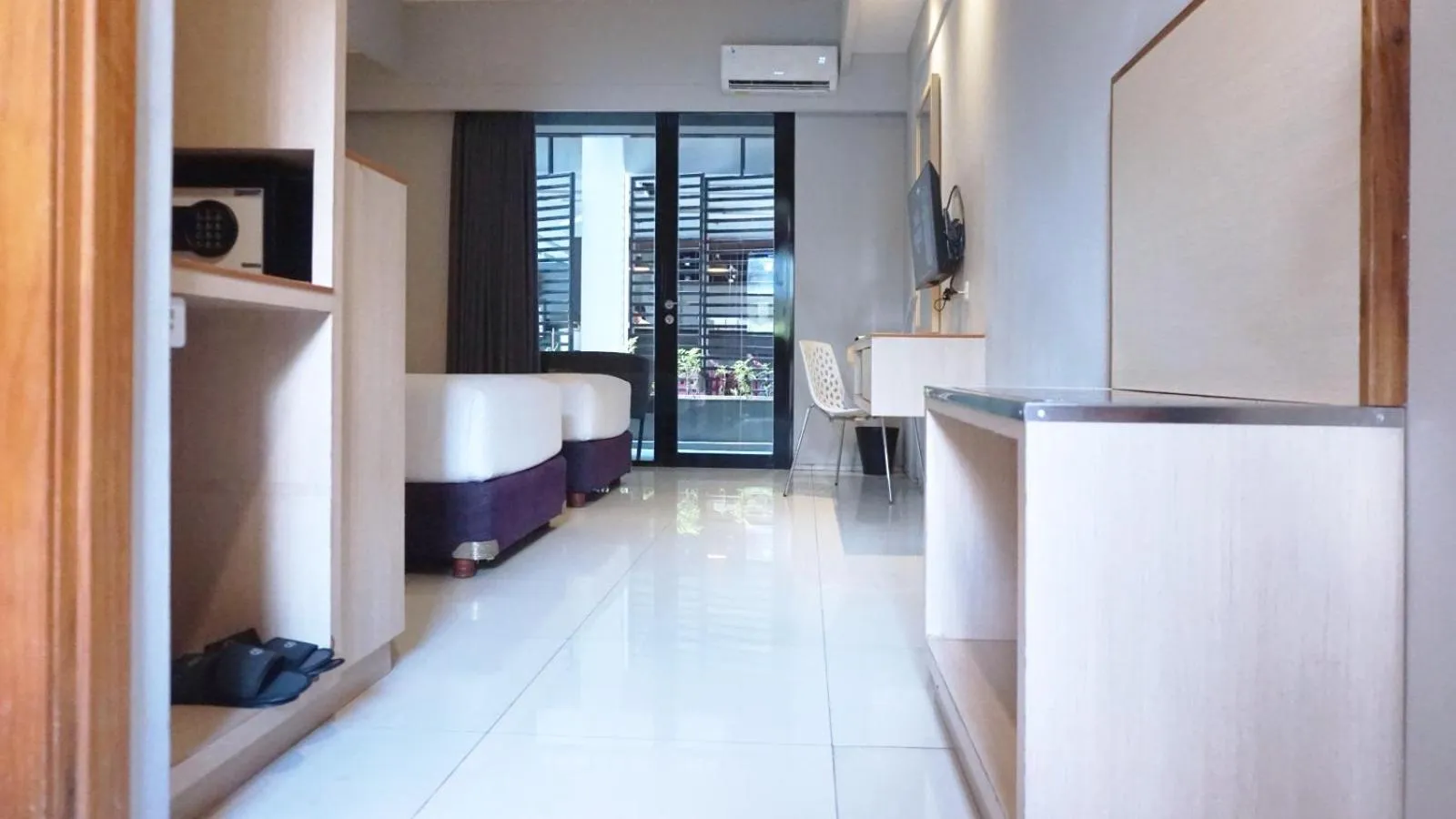 Bed in Conjioo Hotel Kuta Managed By MHM