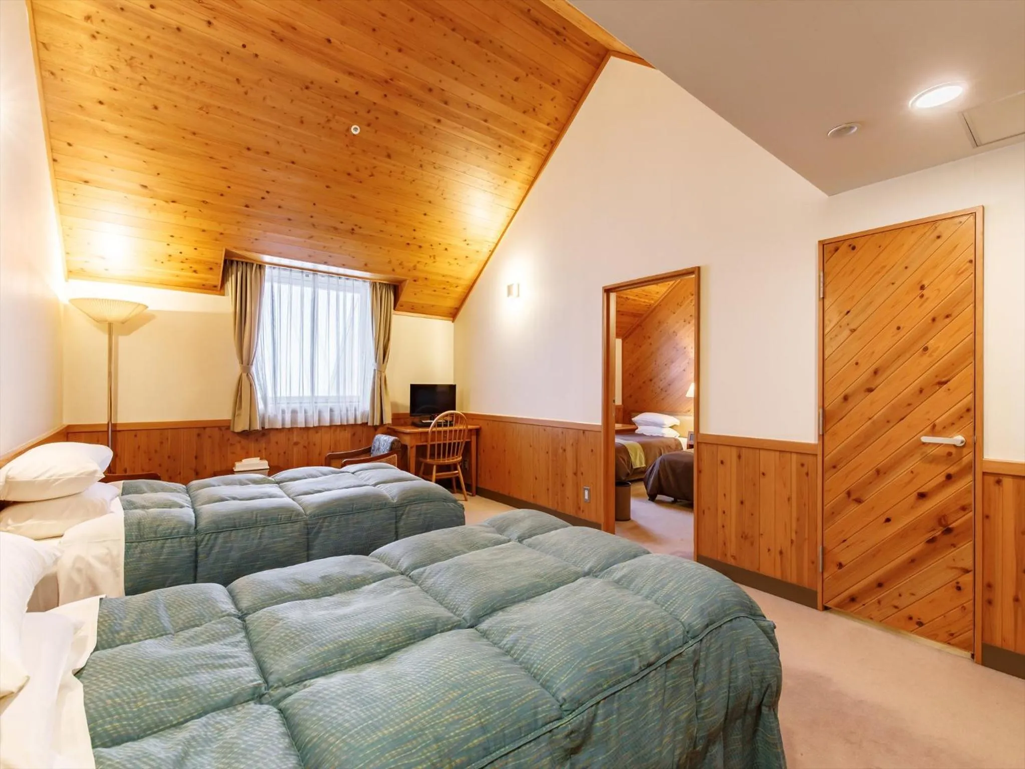 Bed in Kibi Kogen Resort Hotel
