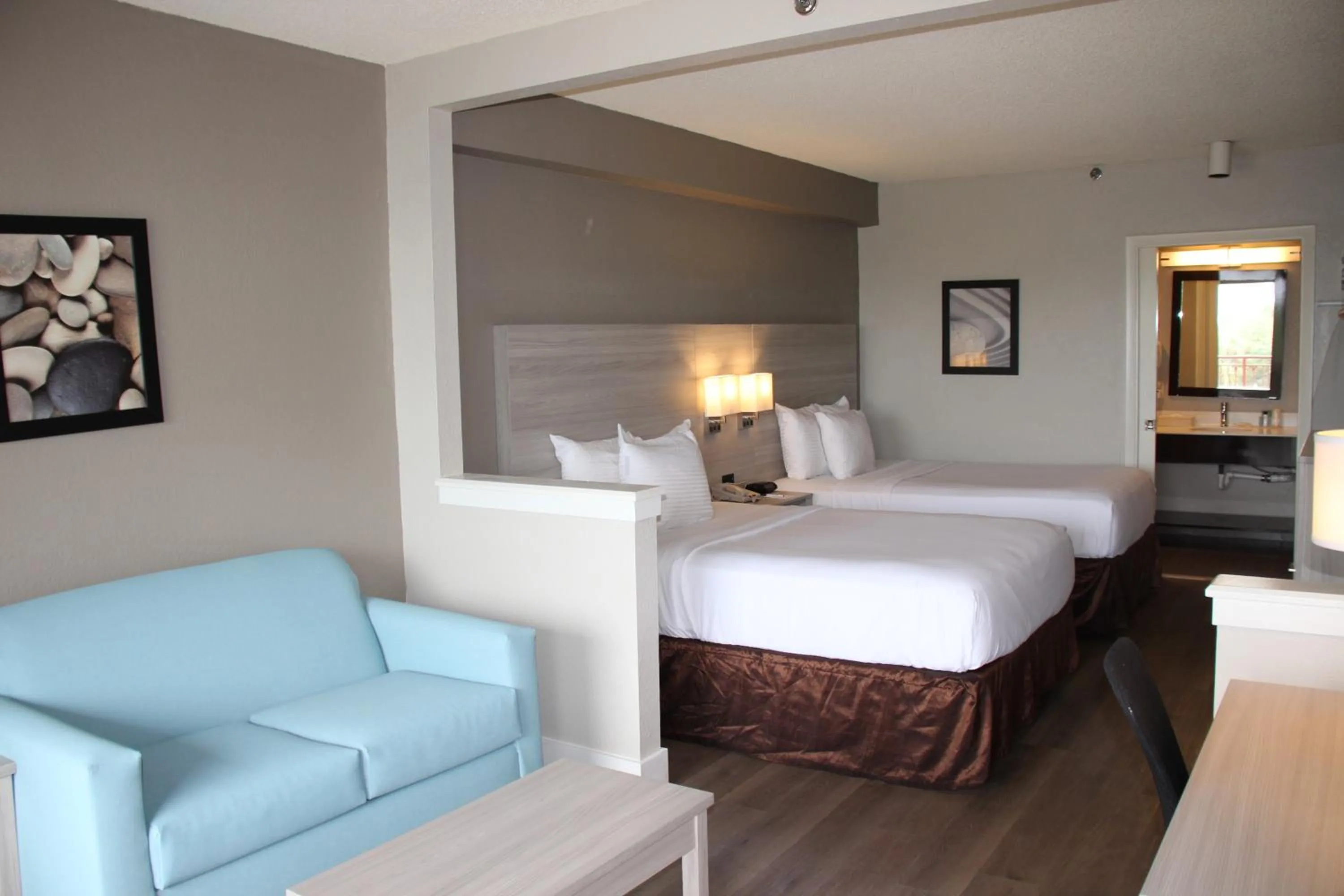 Bed in Boca Suites Deerfield Beach; SureStay Collection by BW