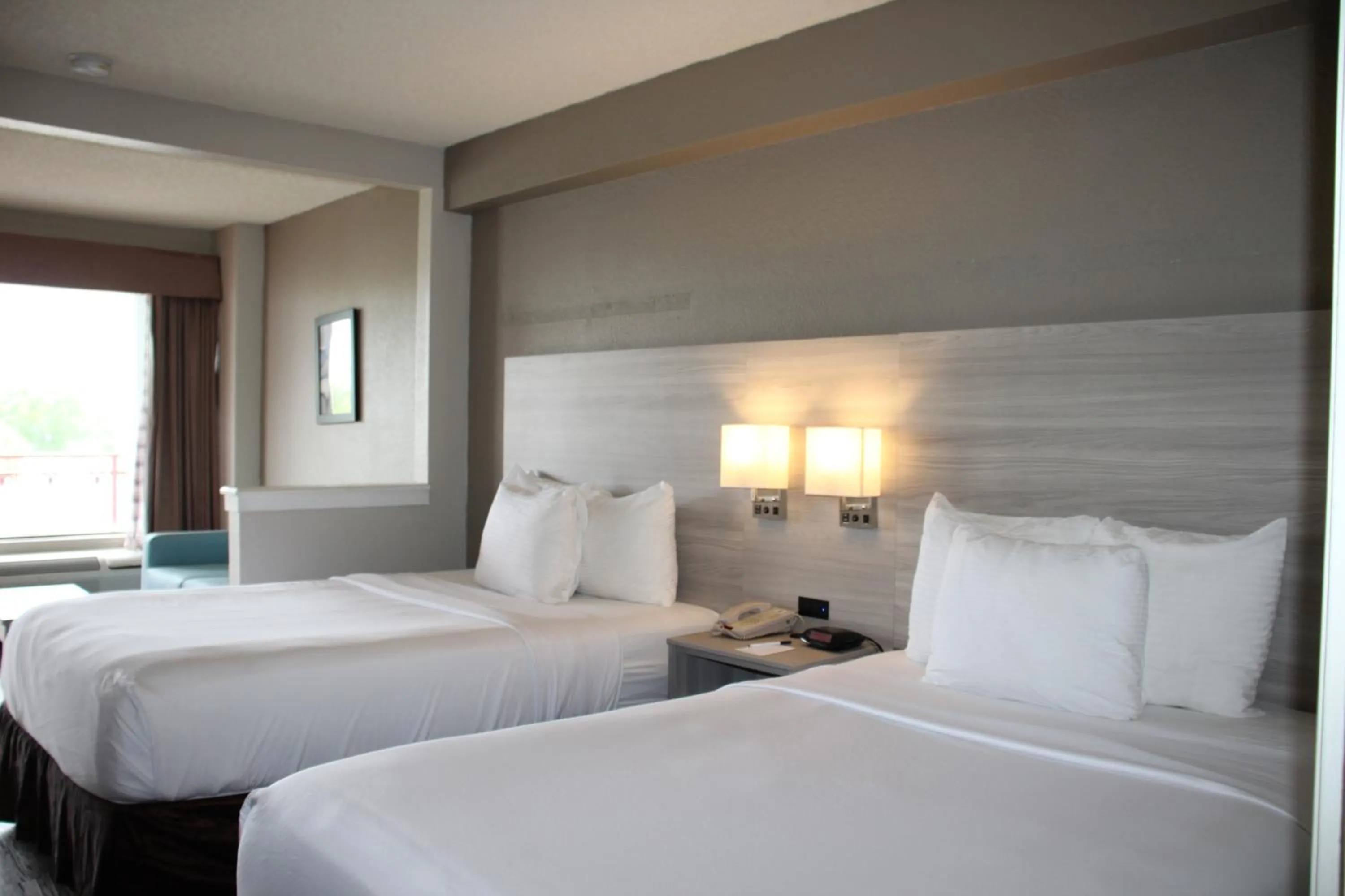 Bed in Boca Suites Deerfield Beach; SureStay Collection by BW