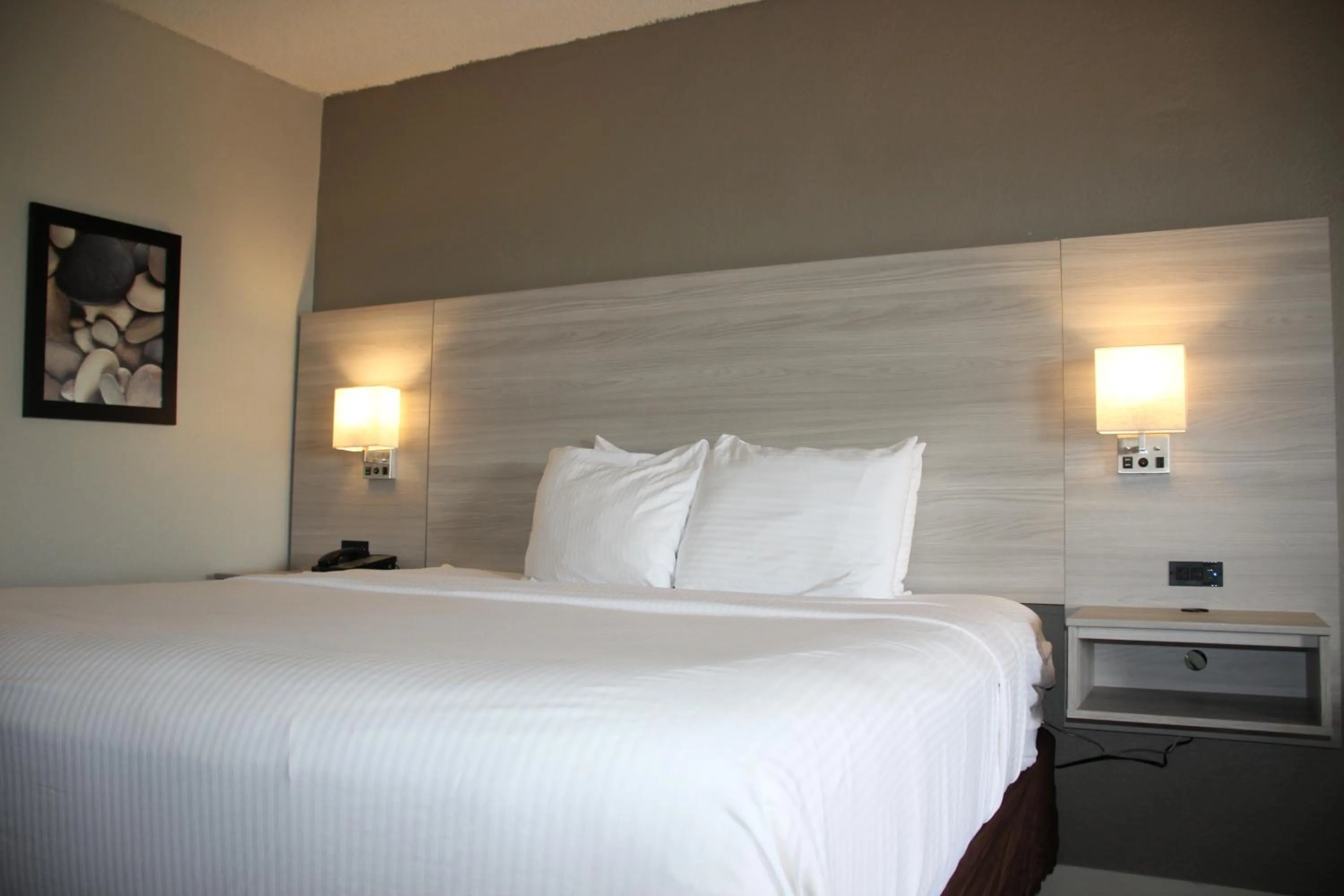 Bed in Boca Suites Deerfield Beach; SureStay Collection by BW