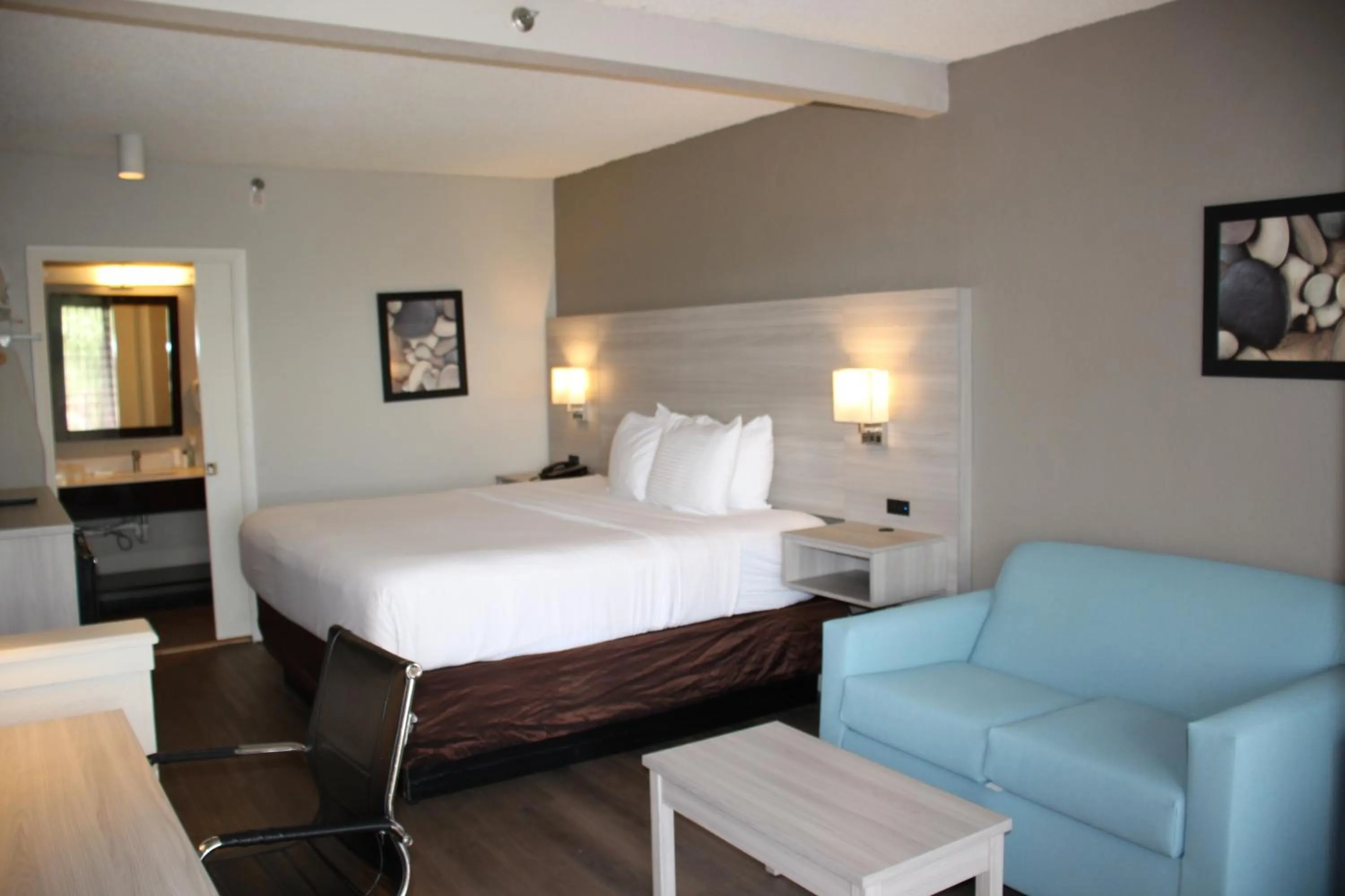 Bed in Boca Suites Deerfield Beach; SureStay Collection by BW