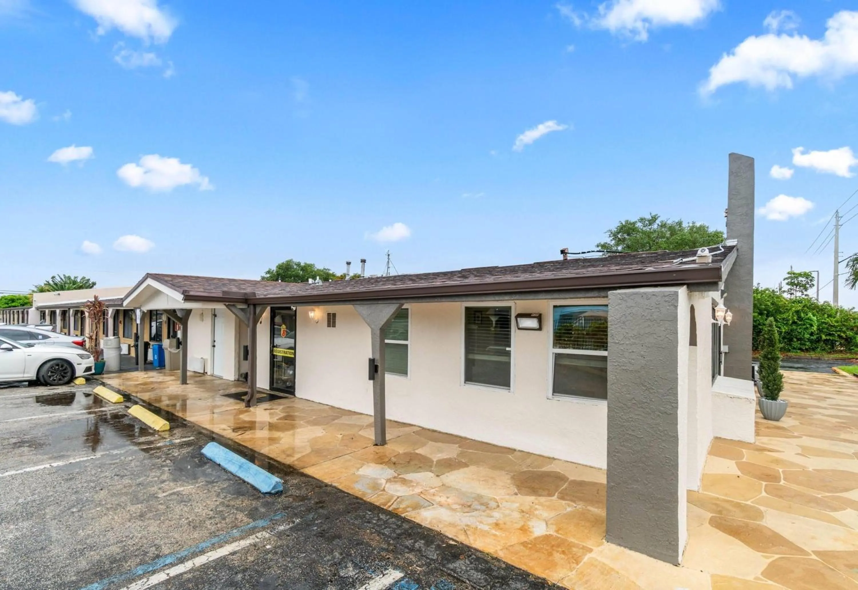 Property building in Super 8 by Wyndham Lantana West Palm Beach