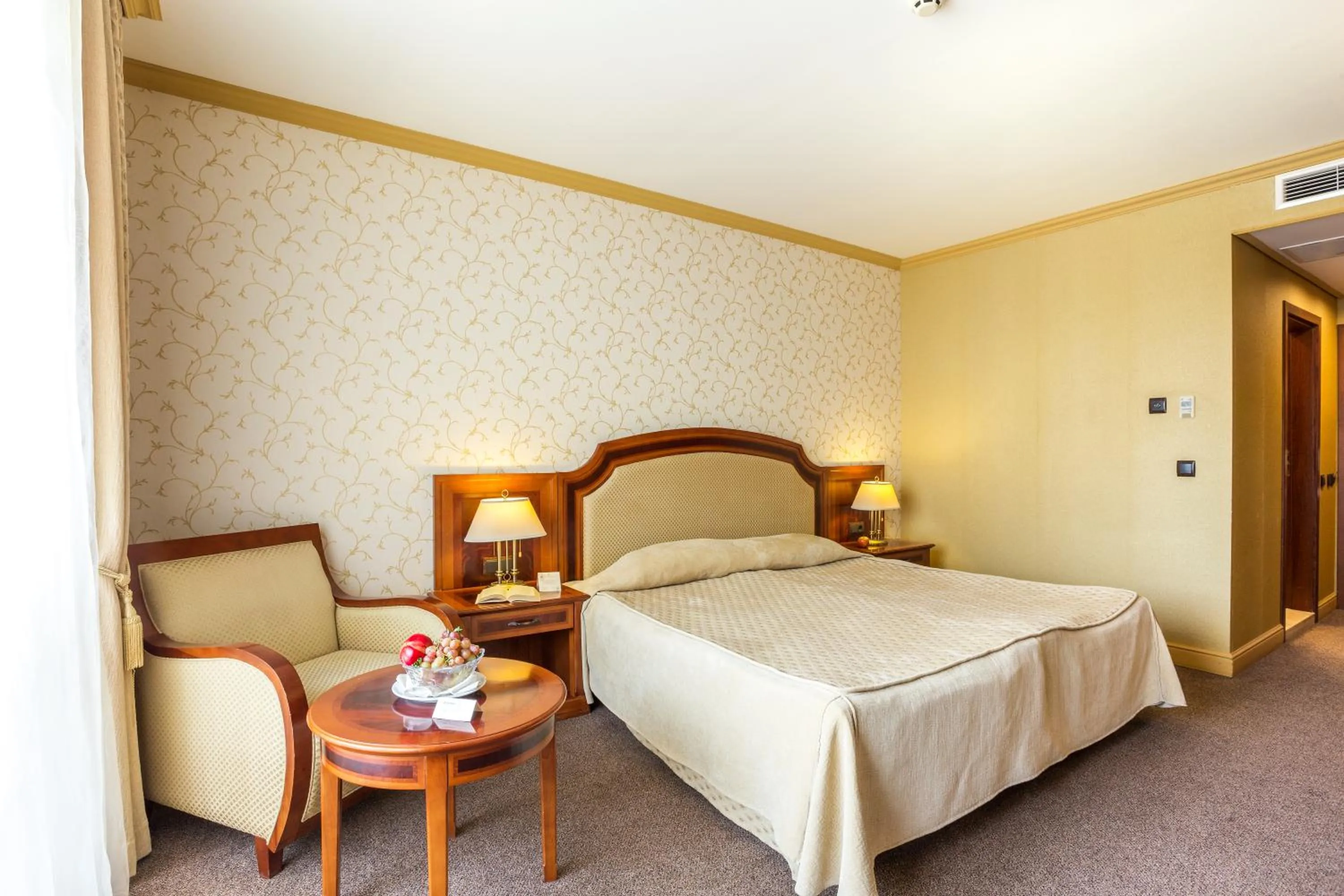 Bed in Romance Hotel and Family Suites