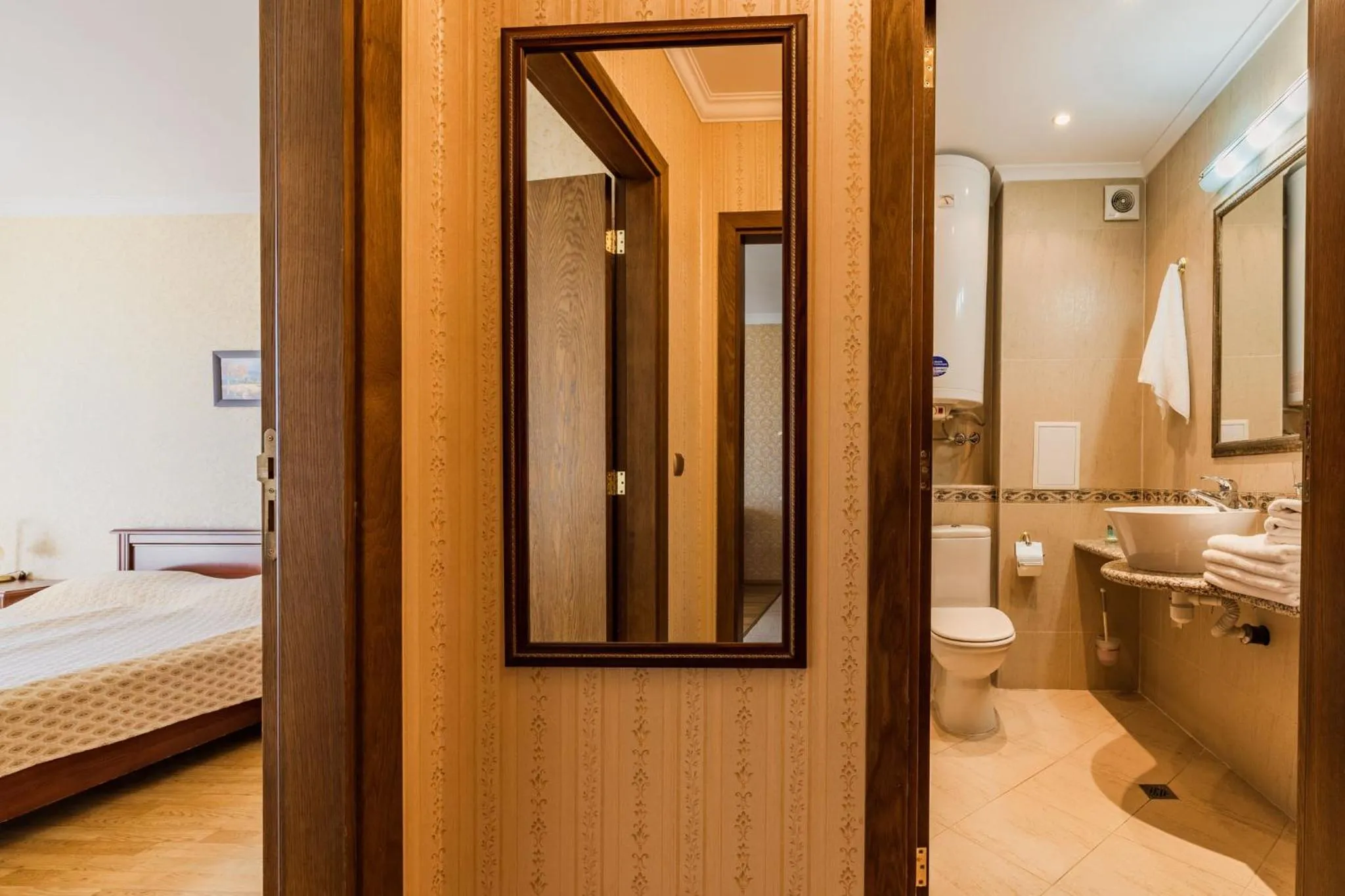 Bed in Romance Hotel and Family Suites