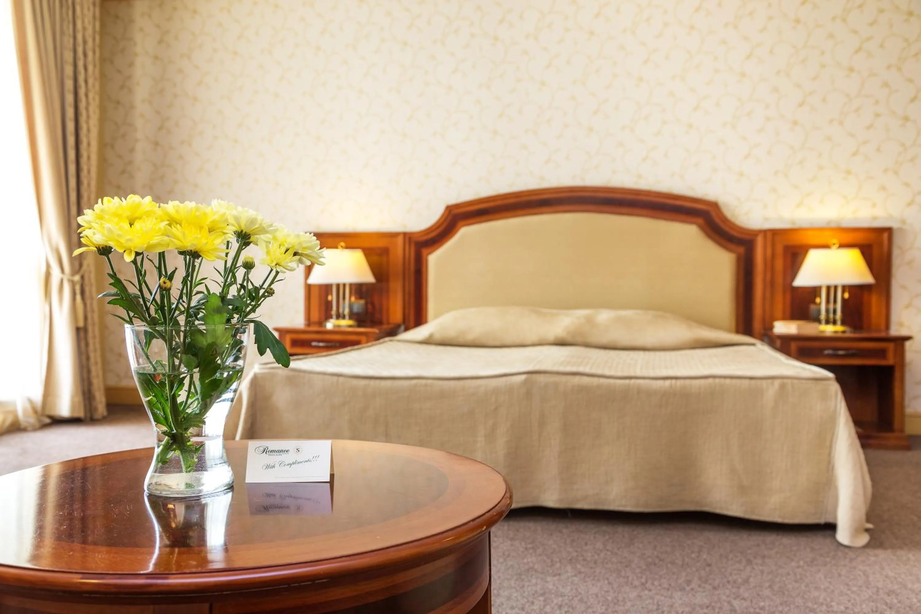 Bed in Romance Hotel and Family Suites