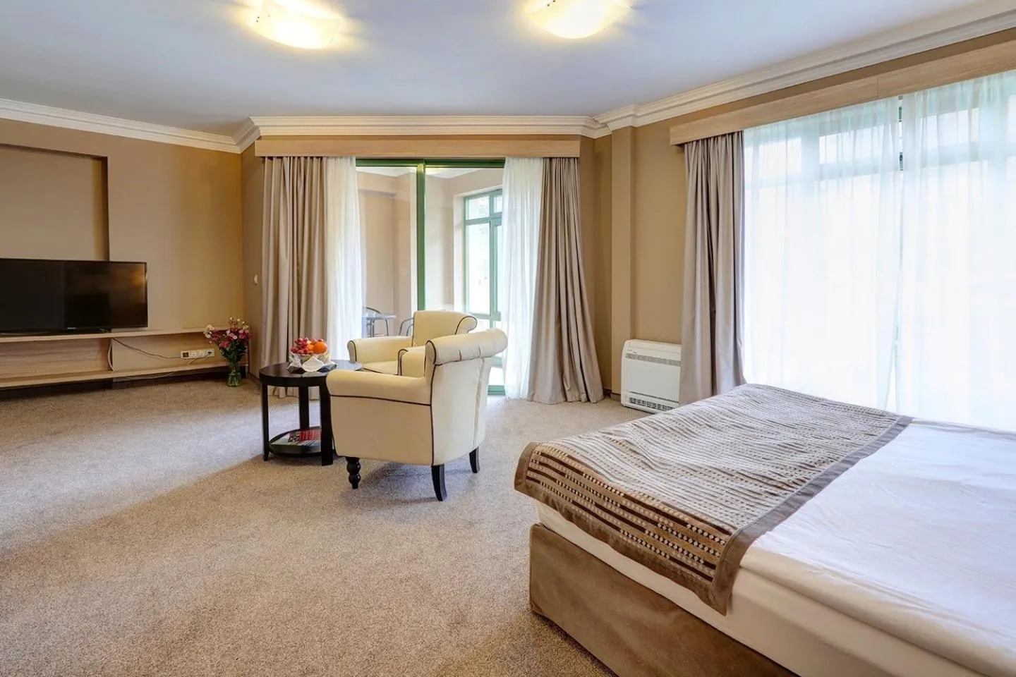 Bed in Romance Hotel and Family Suites