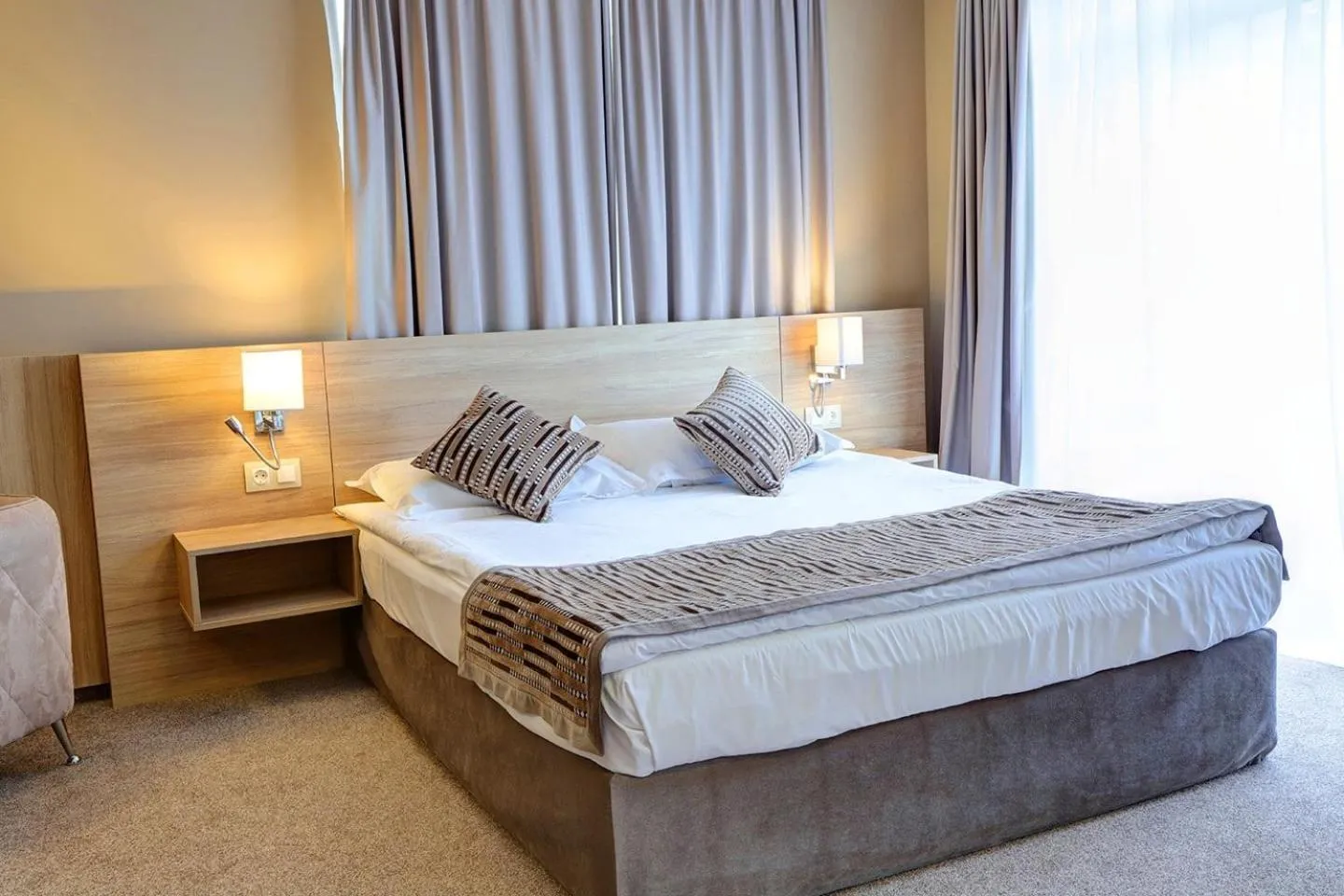 Bed in Romance Hotel and Family Suites