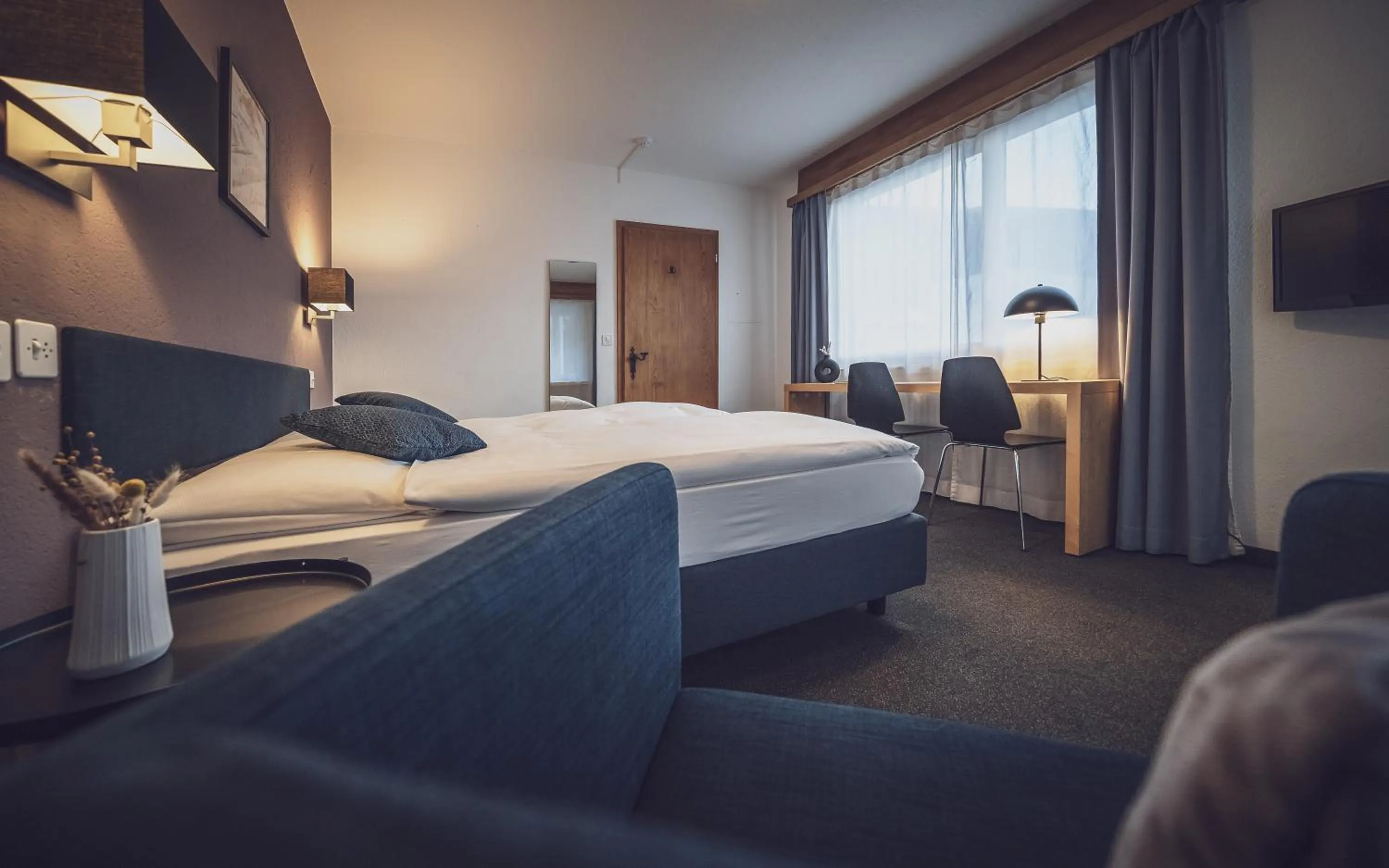 Photo of the whole room, Bed in Hotel Ochsen by Mountain Hotels