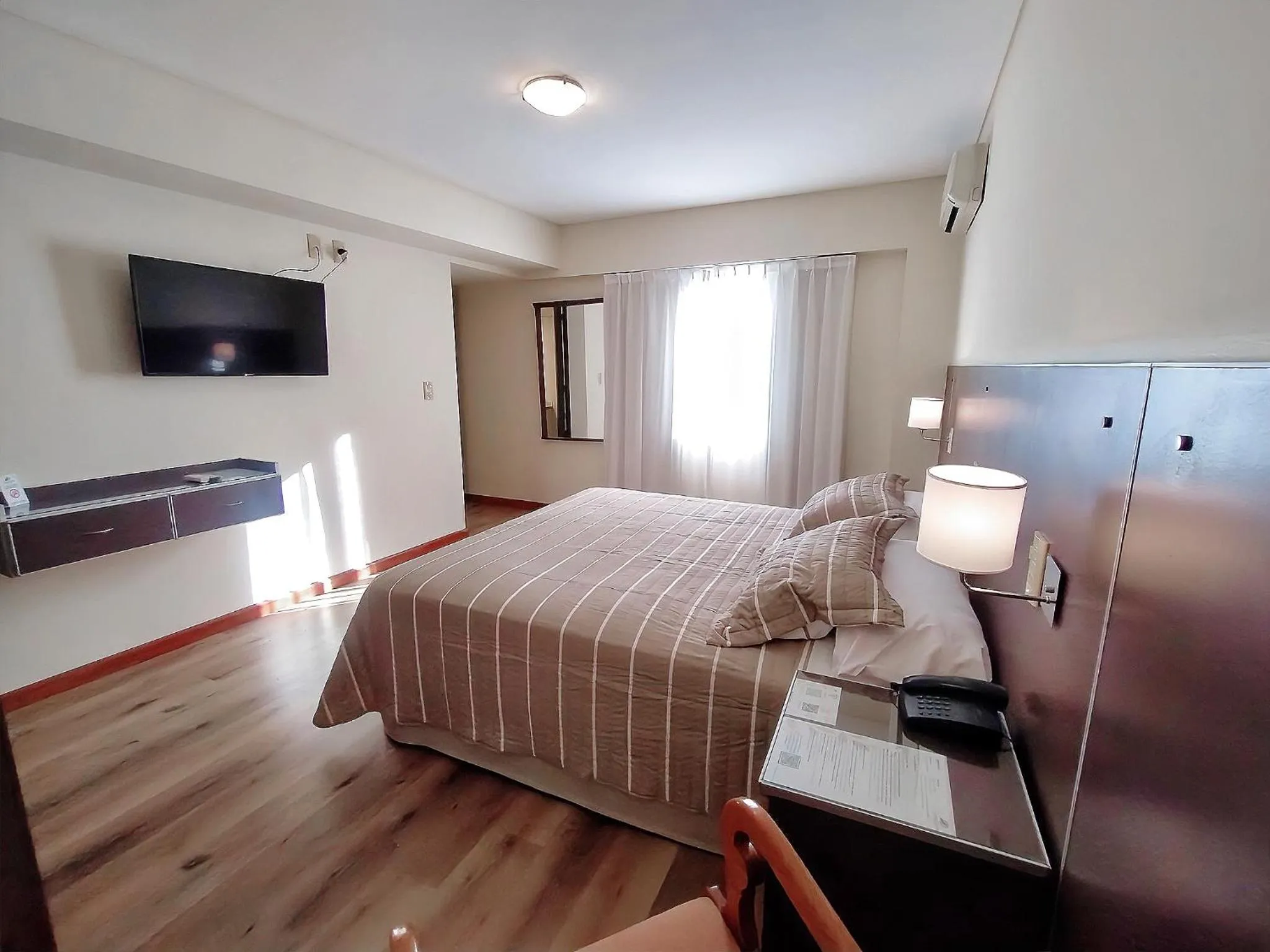 Bed in Cóndor Suites Apart Hotel