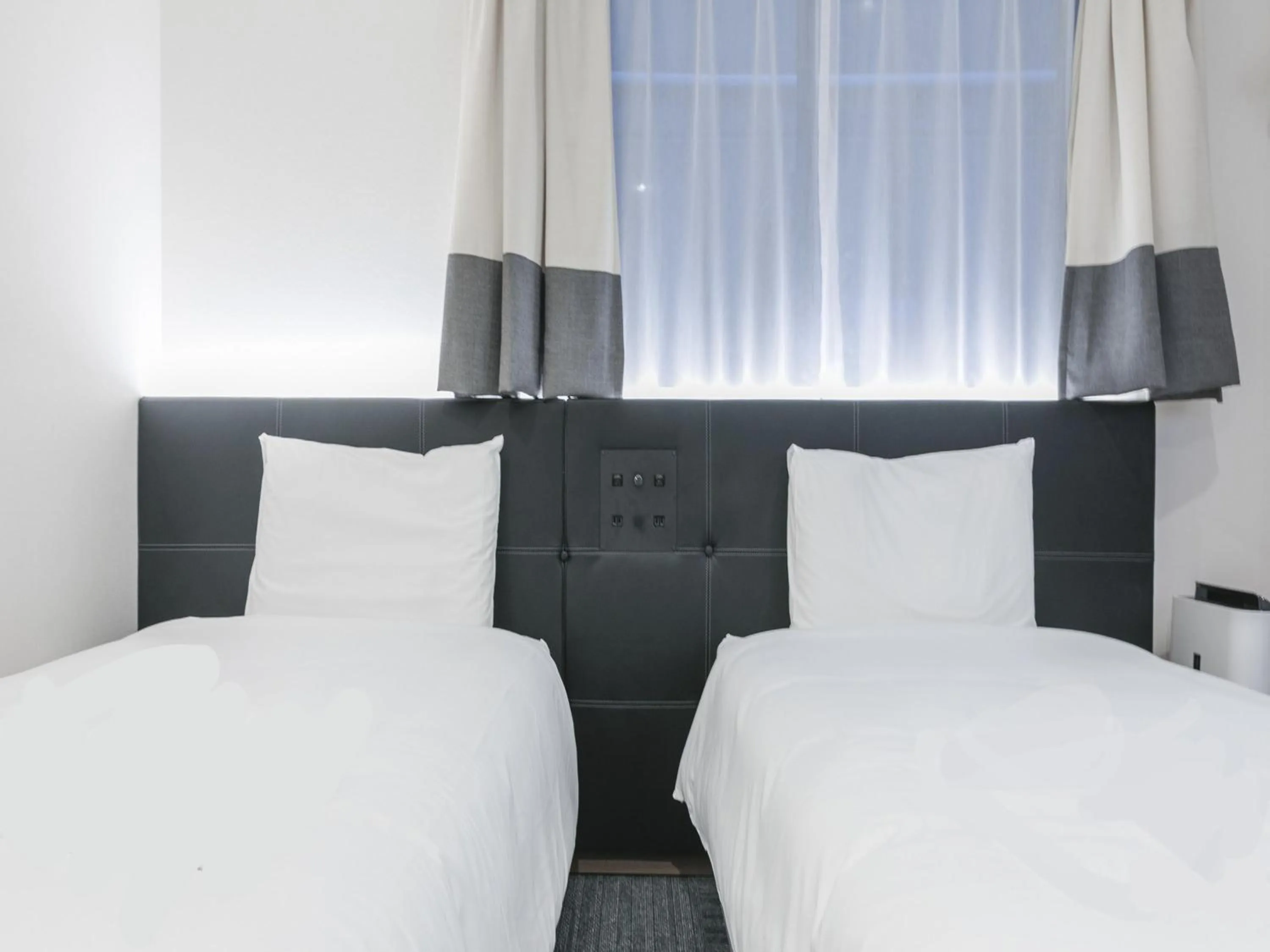 Bed in Henn na Hotel Osaka Namba