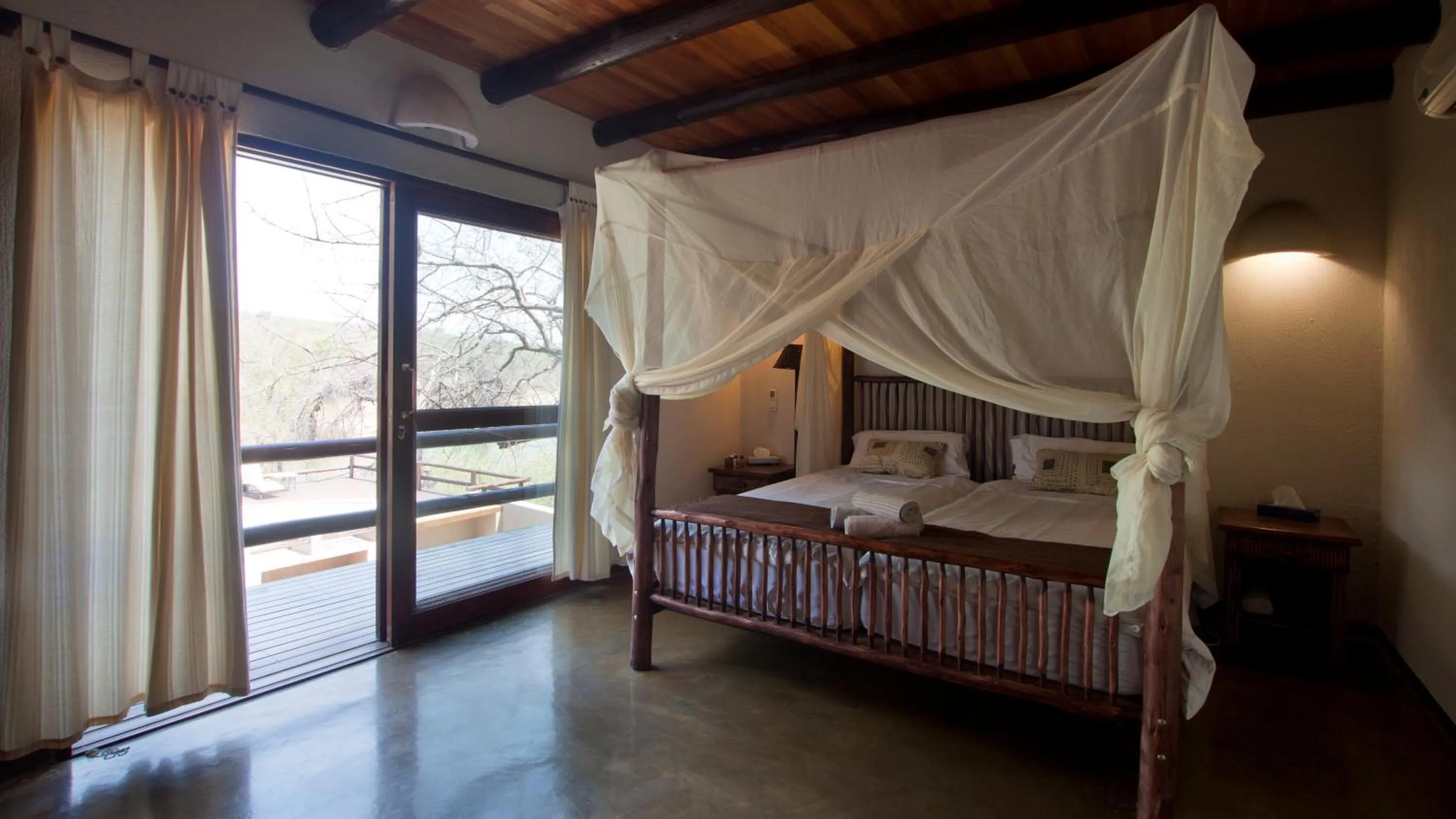 Bed in Nyati Safari Lodge